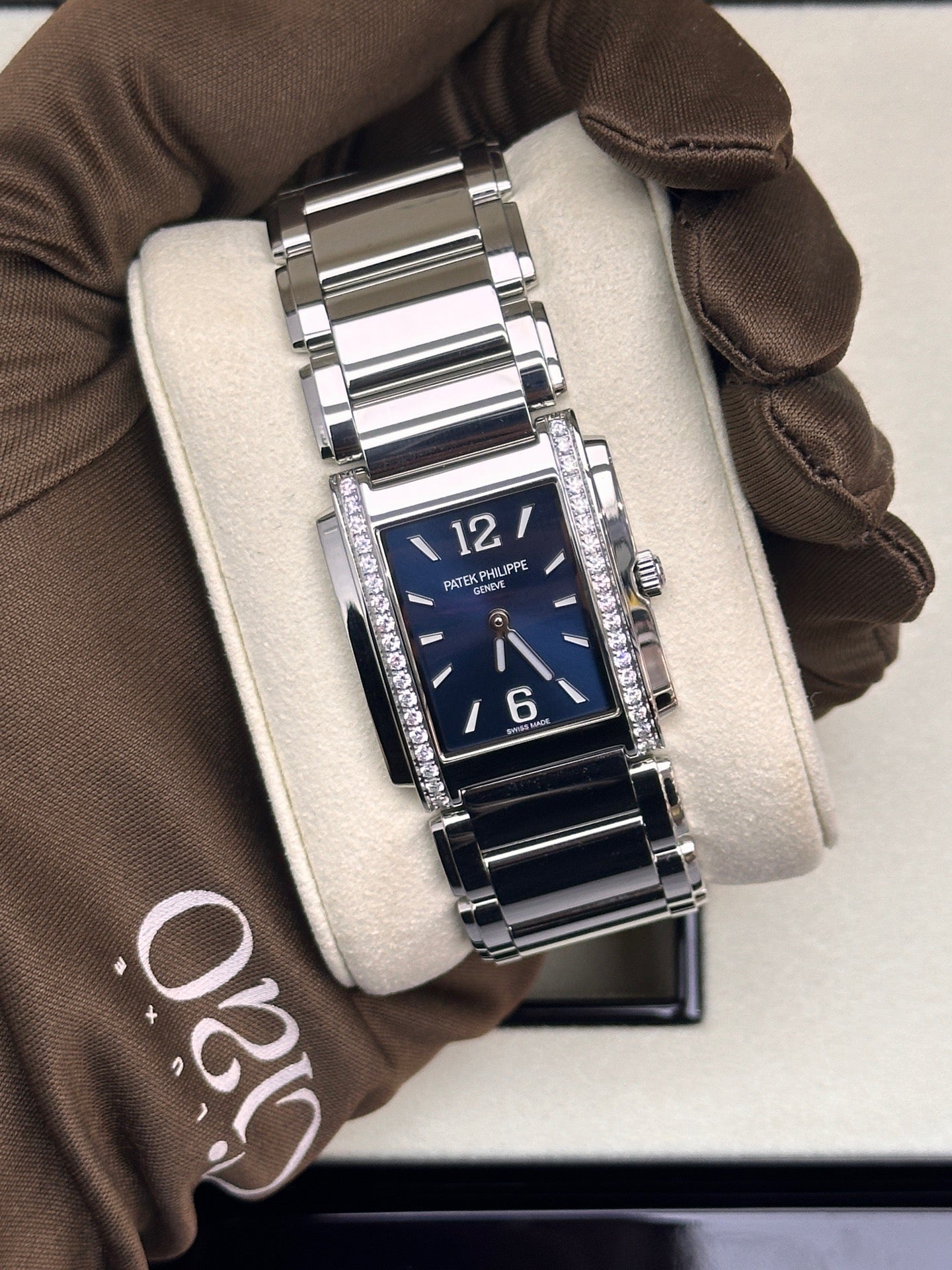 Patek Philippe Twenty~4 Ref. 4910/1200A-001 in stainless steel with a blue sunburst dial and diamond bezel