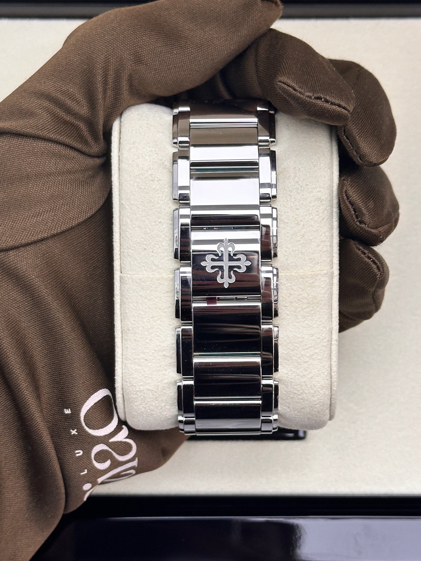 Patek Philippe Twenty~4 Ref. 4910/1200A-001 in stainless steel with a blue sunburst dial and diamond bezel