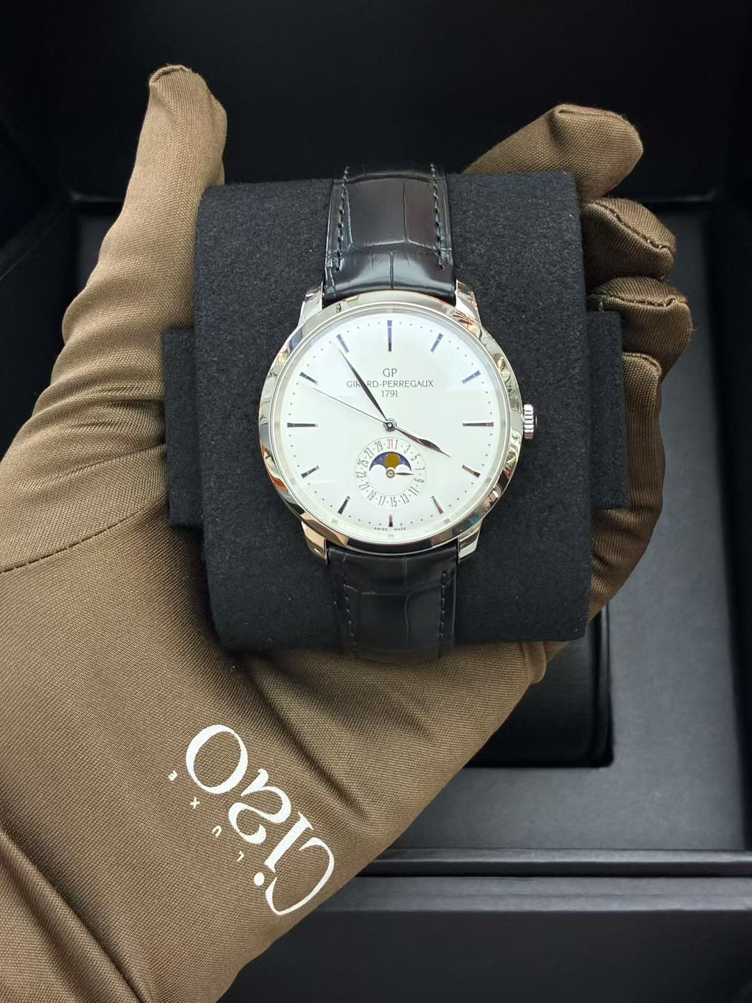 Girard-Perregaux 1966 Date & Moon Phases stainless steel watch with a silver dial and black alligator strap