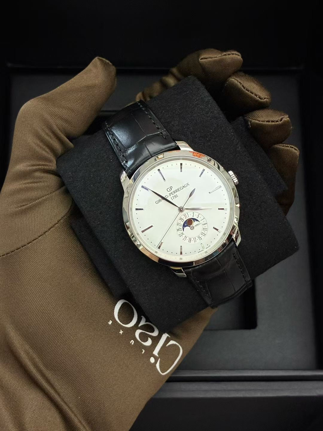 Girard-Perregaux 1966 Date & Moon Phases stainless steel watch with a silver dial and black alligator strap
