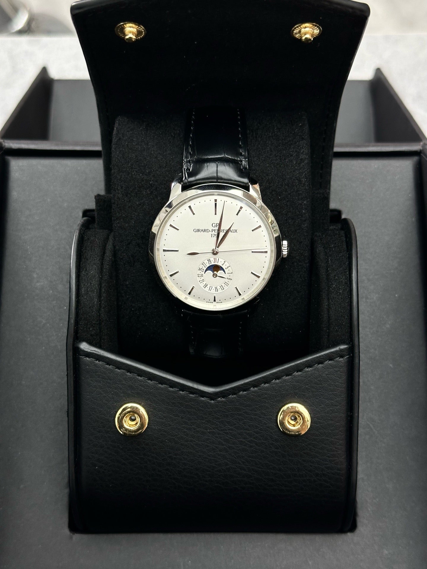 Girard-Perregaux 1966 Date & Moon Phases stainless steel watch with a silver dial and black alligator strap