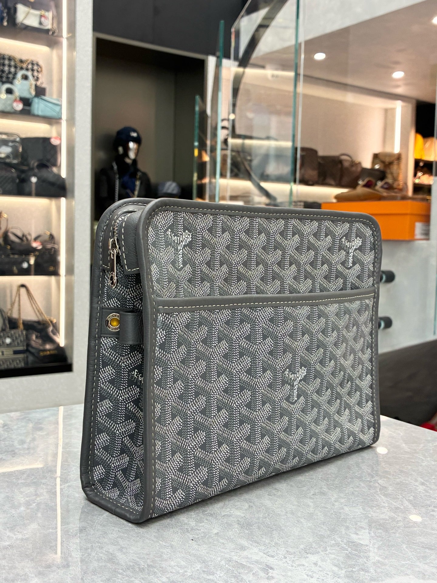 Goyard Jouvence gery toiletry pouch crafted from Goyardine canvas and chevron-patterned material