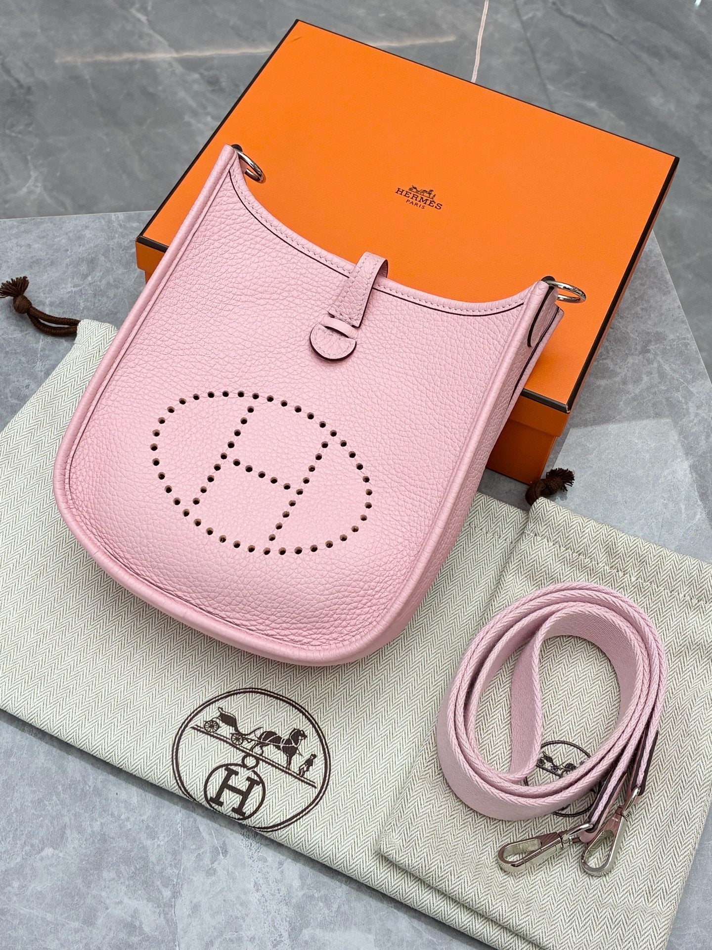 Hermès Mini Evelyne bag in Rose Sakura Clemence leather with silver-tone hardware