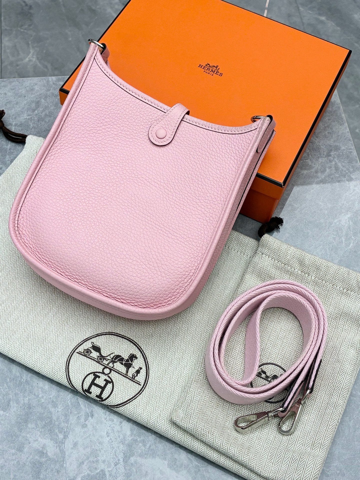 Hermès Mini Evelyne bag in Rose Sakura Clemence leather with silver-tone hardware