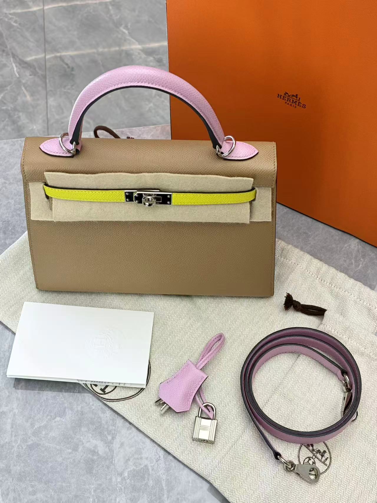 Hermès Kelly 25 Sellier handbag in tri-color Chai, Lime, and Mauve Sylvestre Epsom leather with palladium hardware