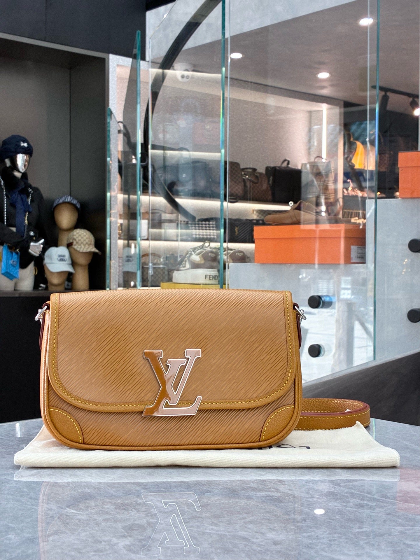 Louis Vuitton Buci crossbody bag crafted from honey-colored Epi leather