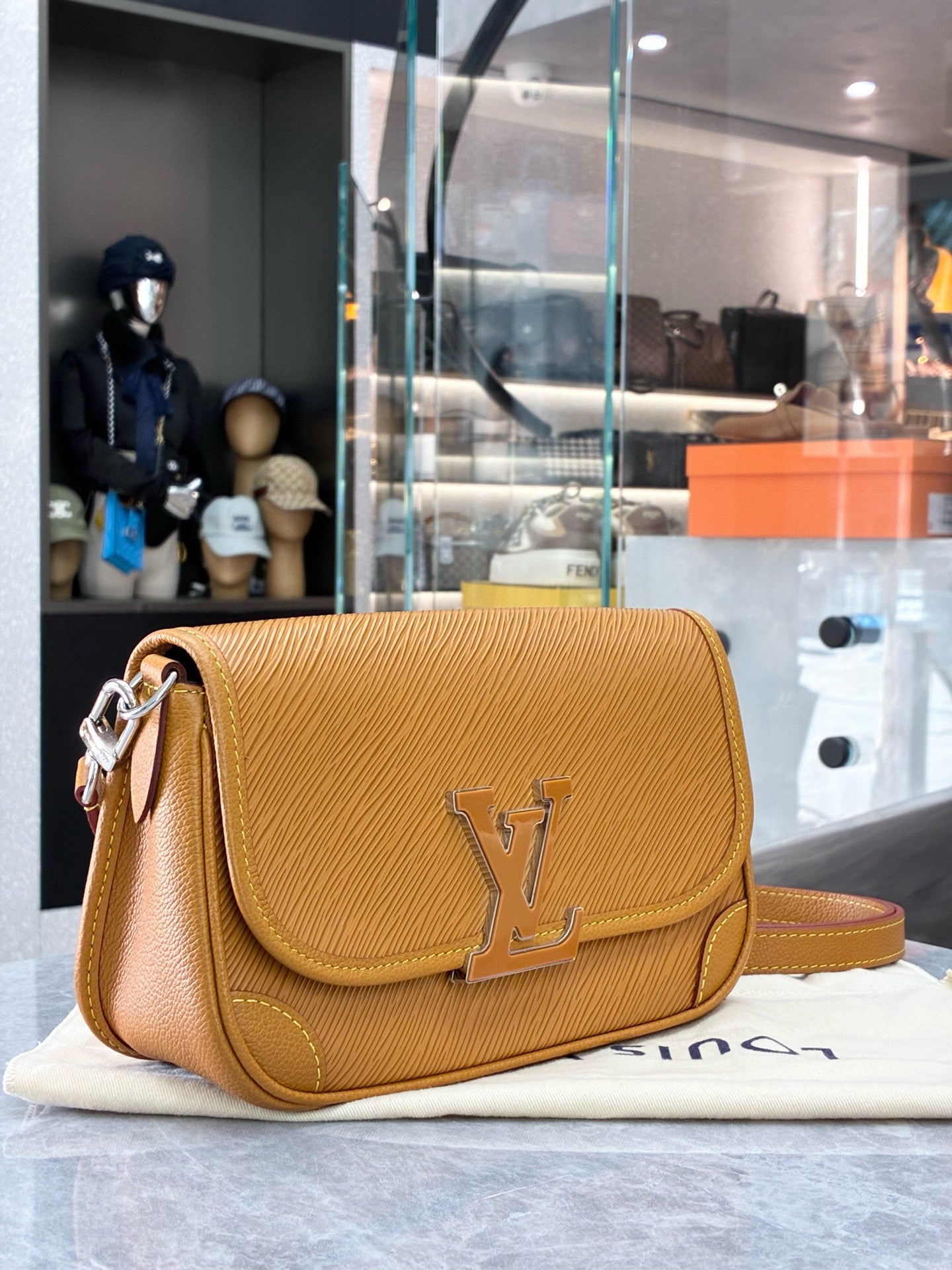 Louis Vuitton Buci crossbody bag crafted from honey-colored Epi leather