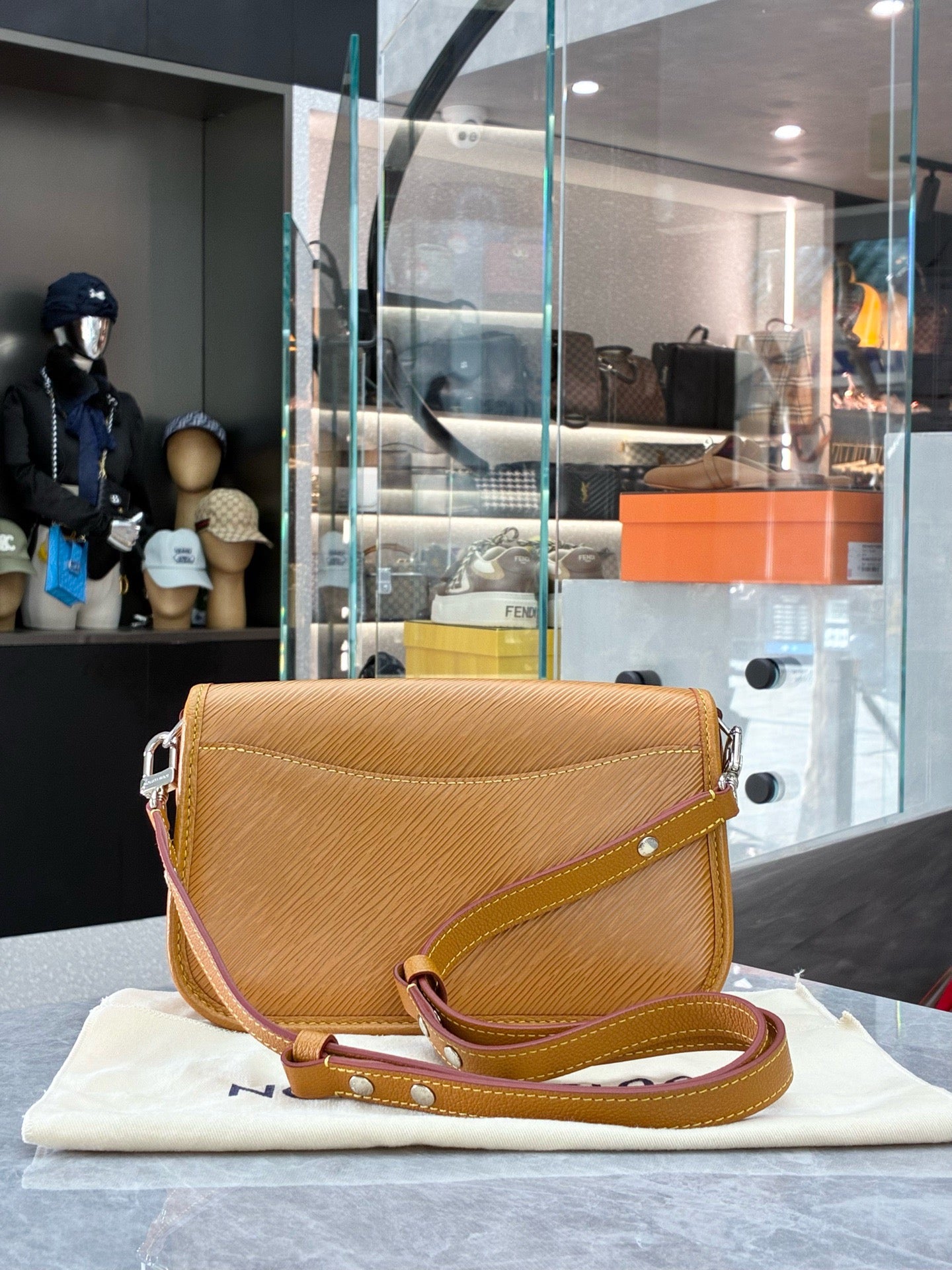 Louis Vuitton Buci crossbody bag crafted from honey-colored Epi leather