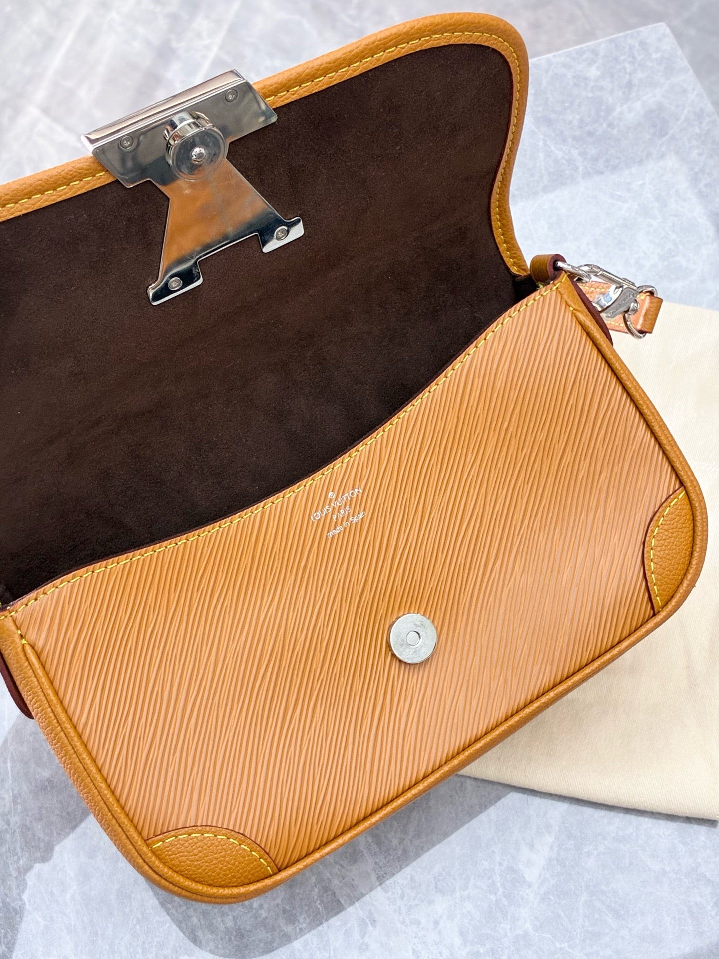 Louis Vuitton Buci crossbody bag crafted from honey-colored Epi leather