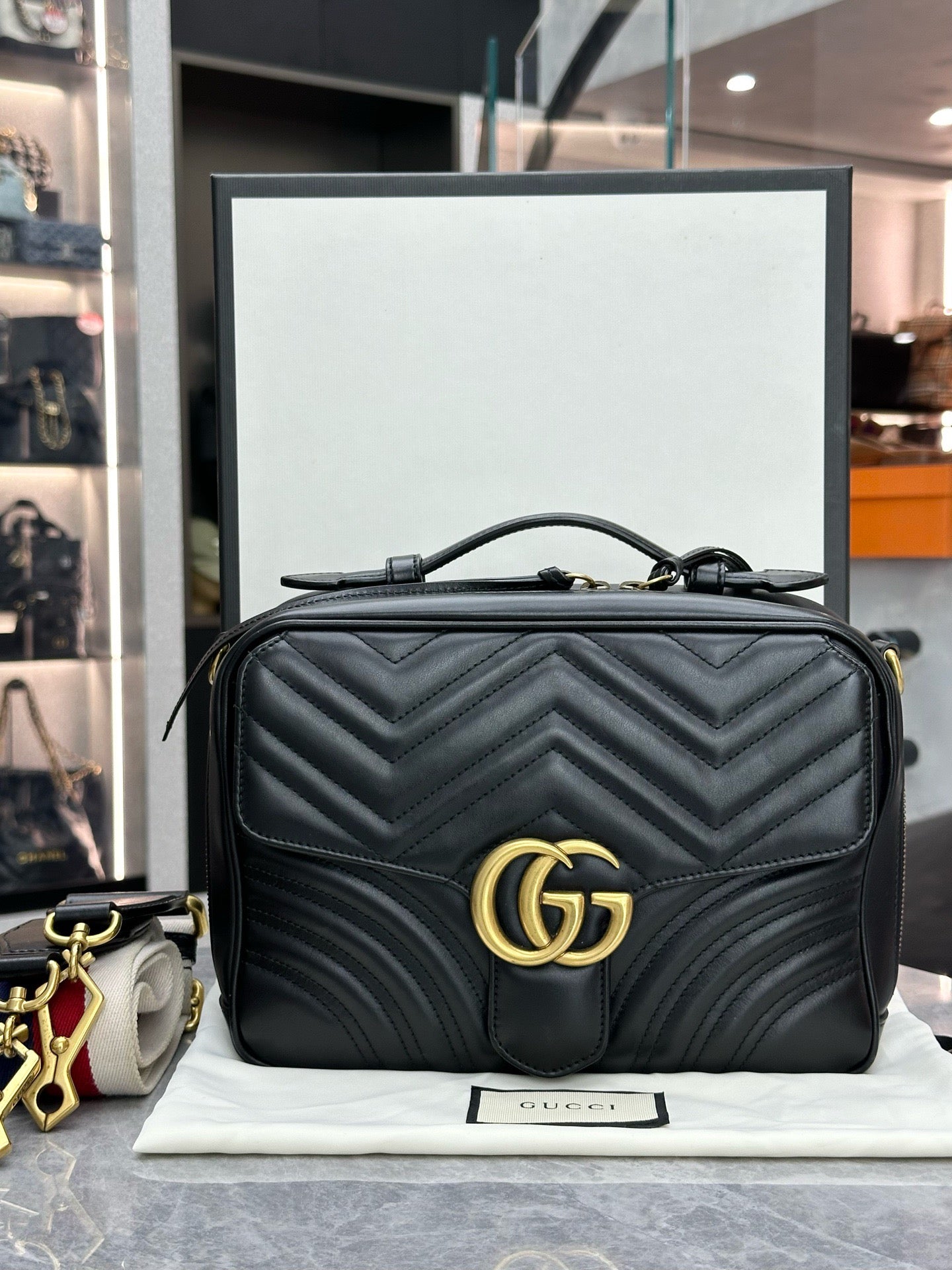 Gucci GG Marmont Small Top Handle Bag in black chevron matelassé leather with gold-toned hardware
