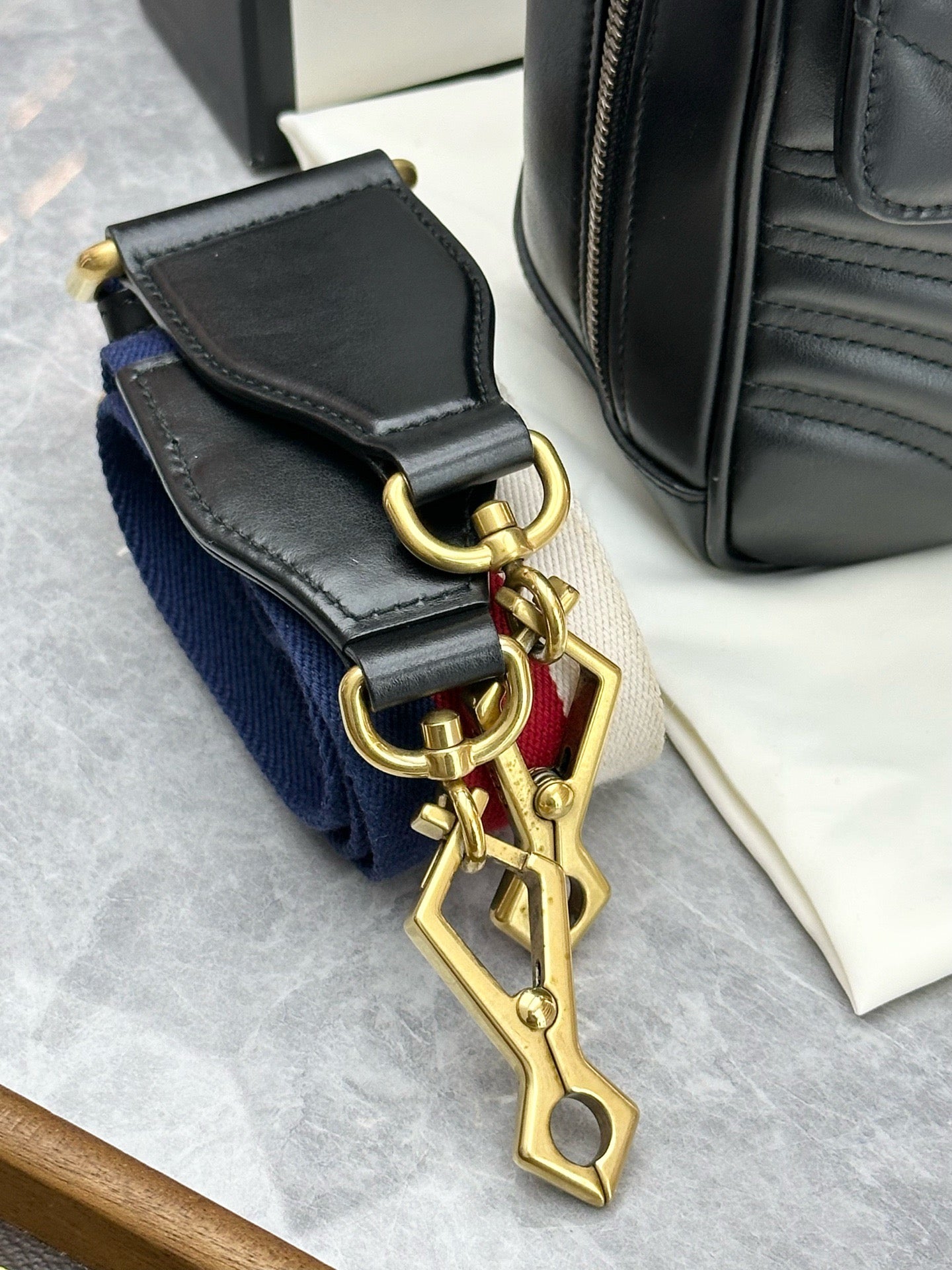 Gucci GG Marmont Small Top Handle Bag in black chevron matelassé leather with gold-toned hardware