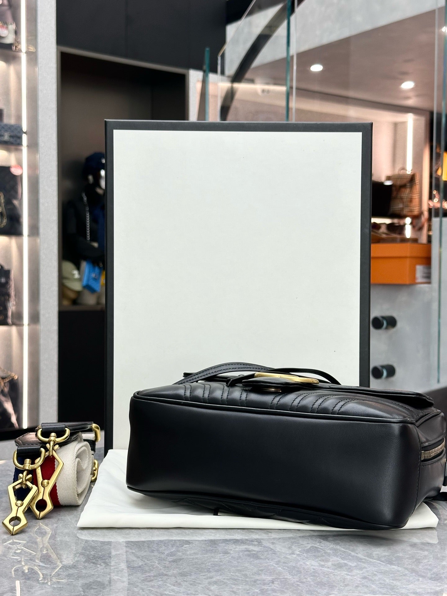 Gucci GG Marmont Small Top Handle Bag in black chevron matelassé leather with gold-toned hardware