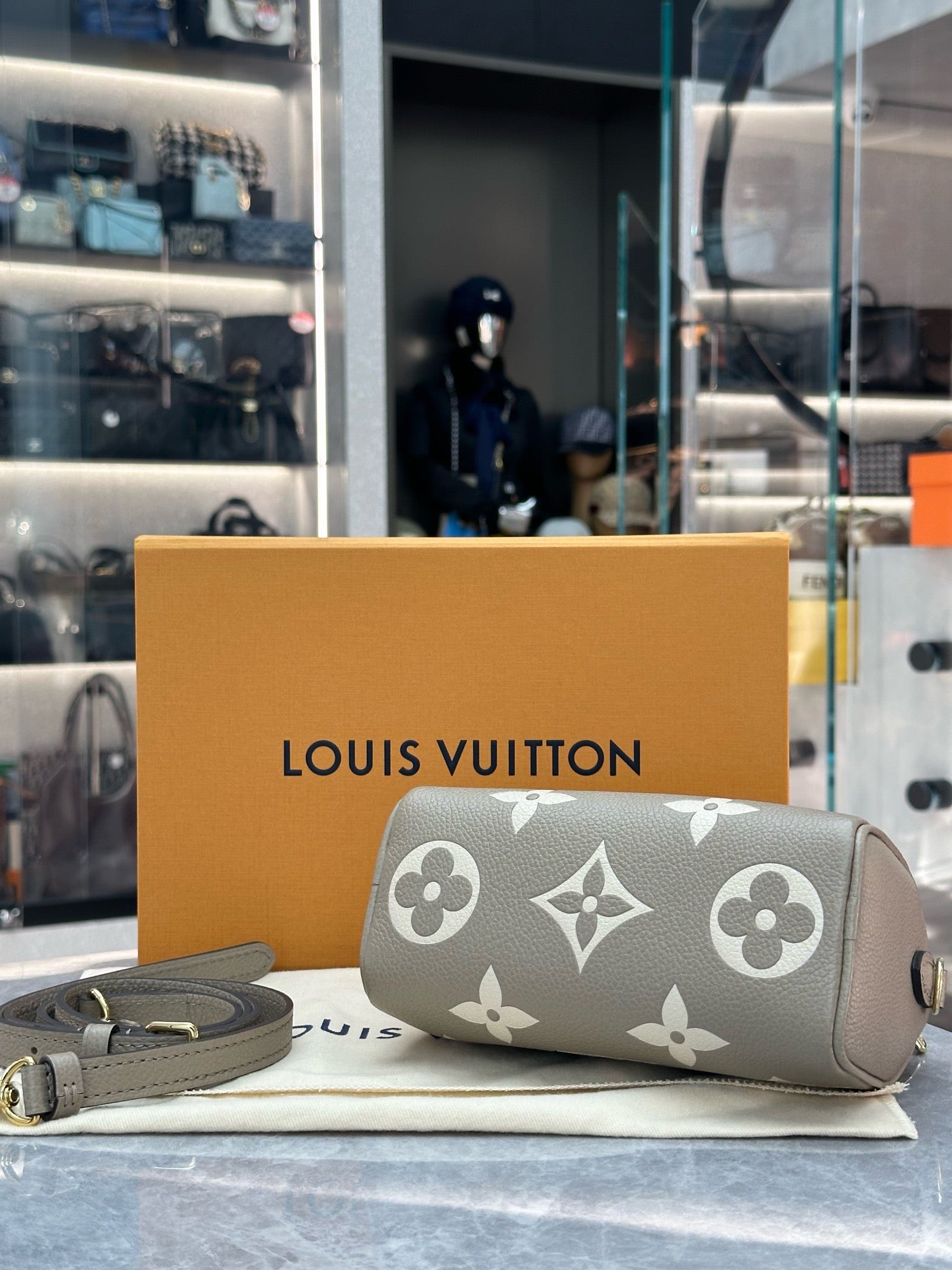 Louis Vuitton Nano Speedy handbag in Tourterelle and Creme embossed Empreinte leather