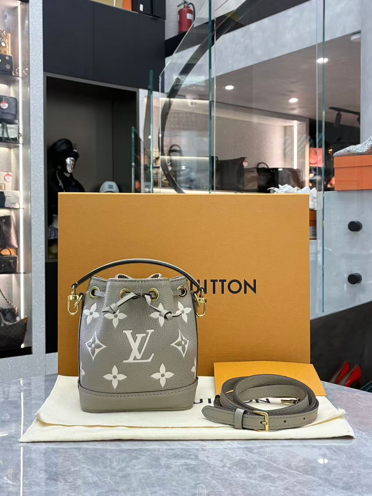 Louis Vuitton Nano Noé bag is crafted from bicolour Monogram Empreinte leather
