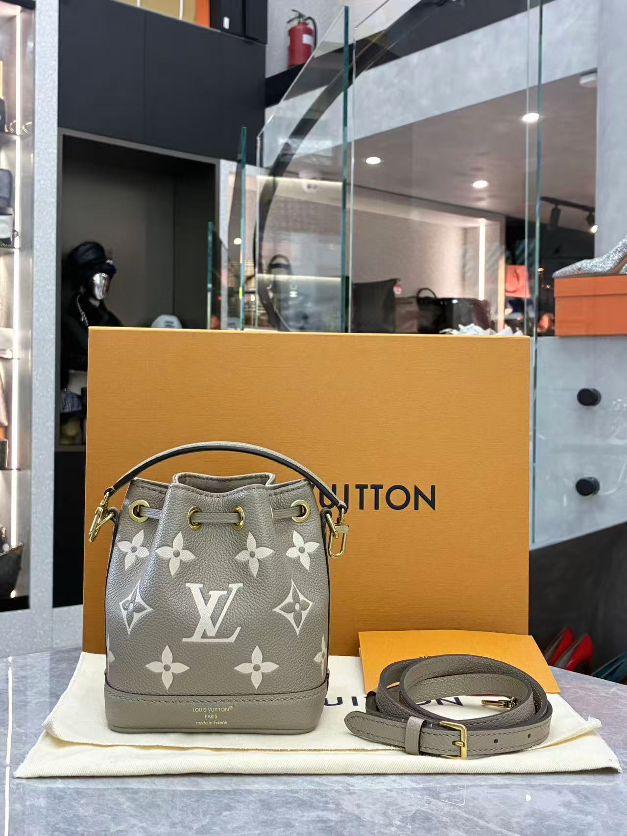 Louis Vuitton Nano Noé bag is crafted from bicolour Monogram Empreinte leather