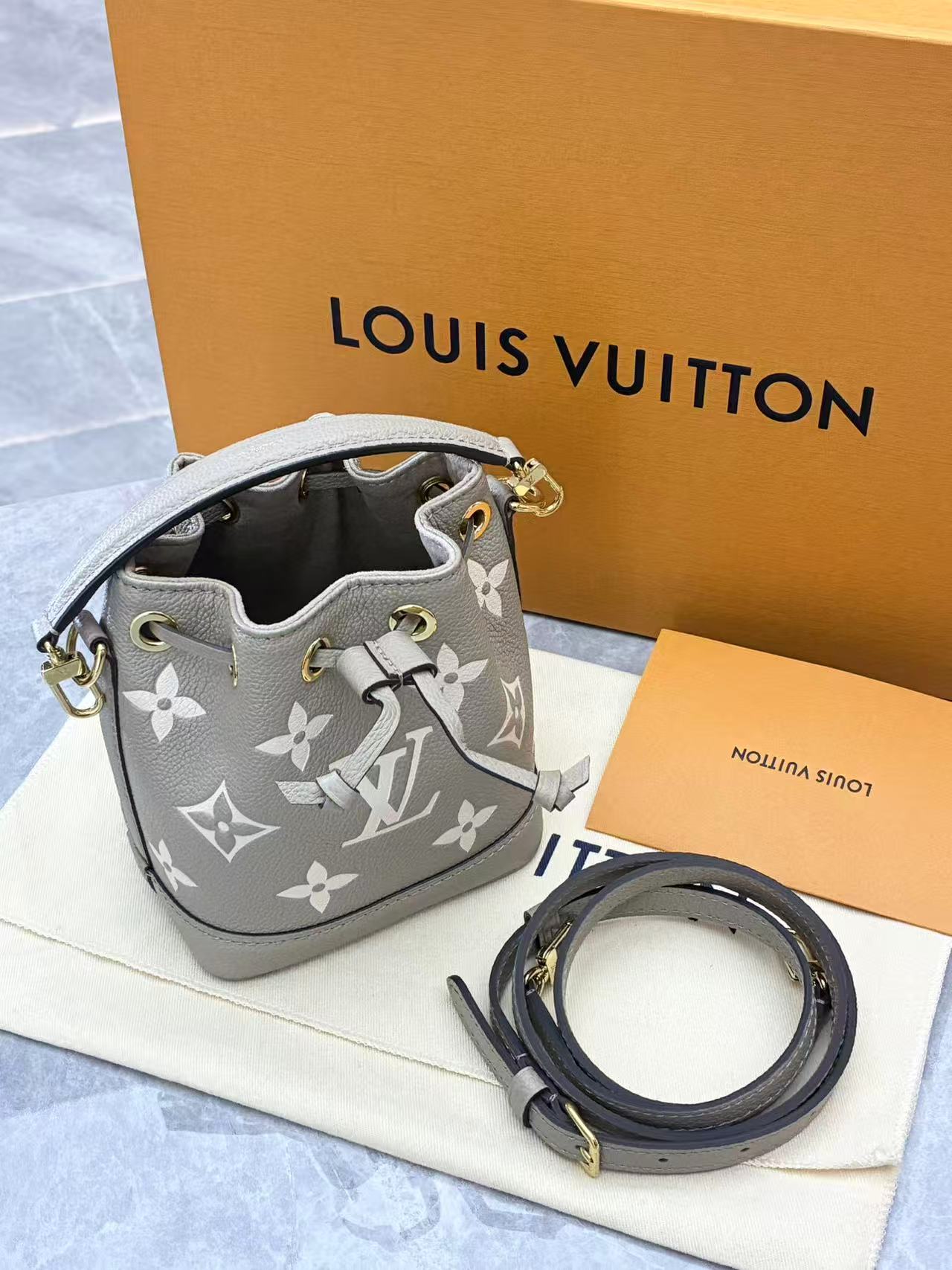 Louis Vuitton Nano Noé bag is crafted from bicolour Monogram Empreinte leather
