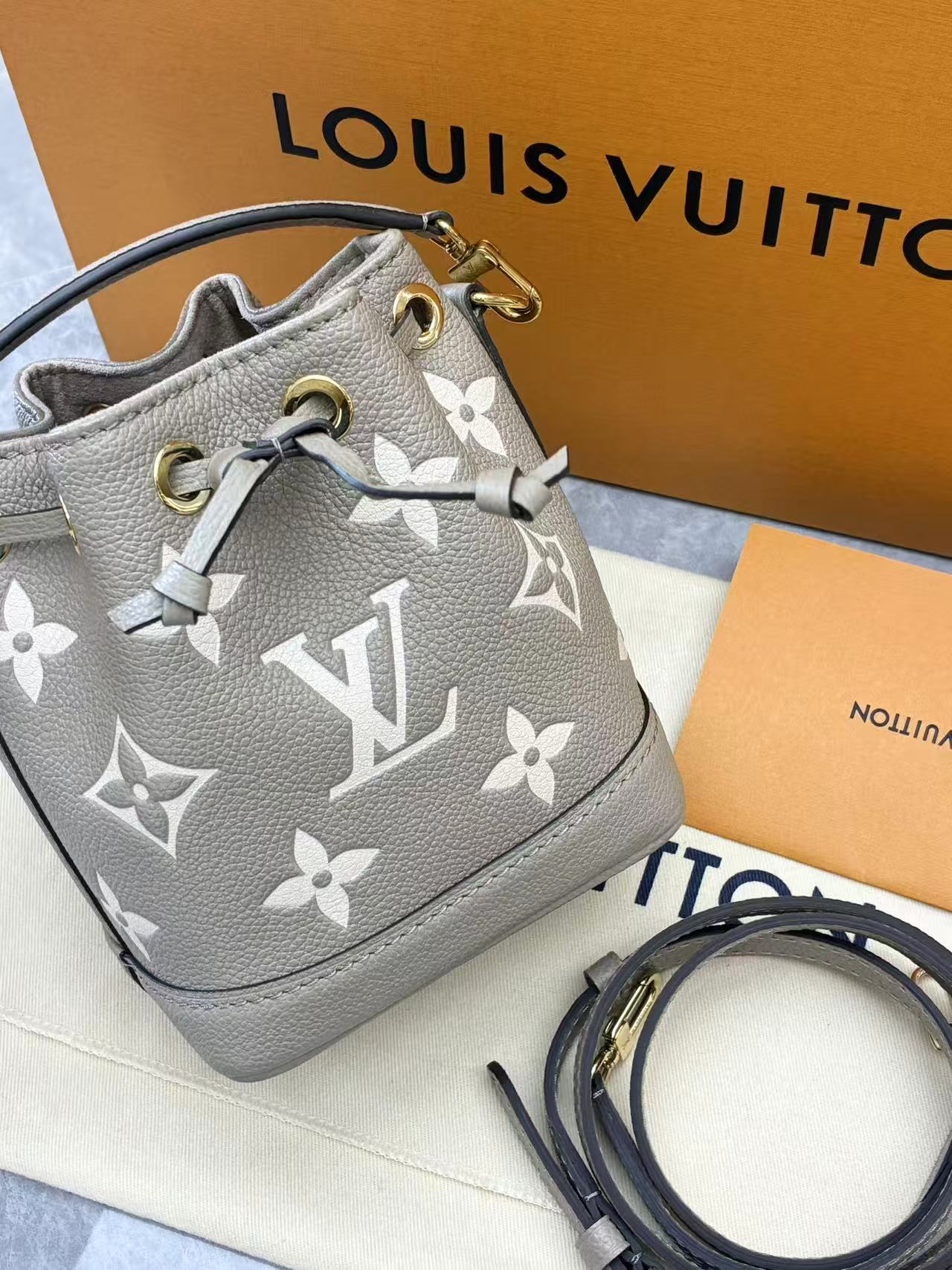 Louis Vuitton Nano Noé bag is crafted from bicolour Monogram Empreinte leather