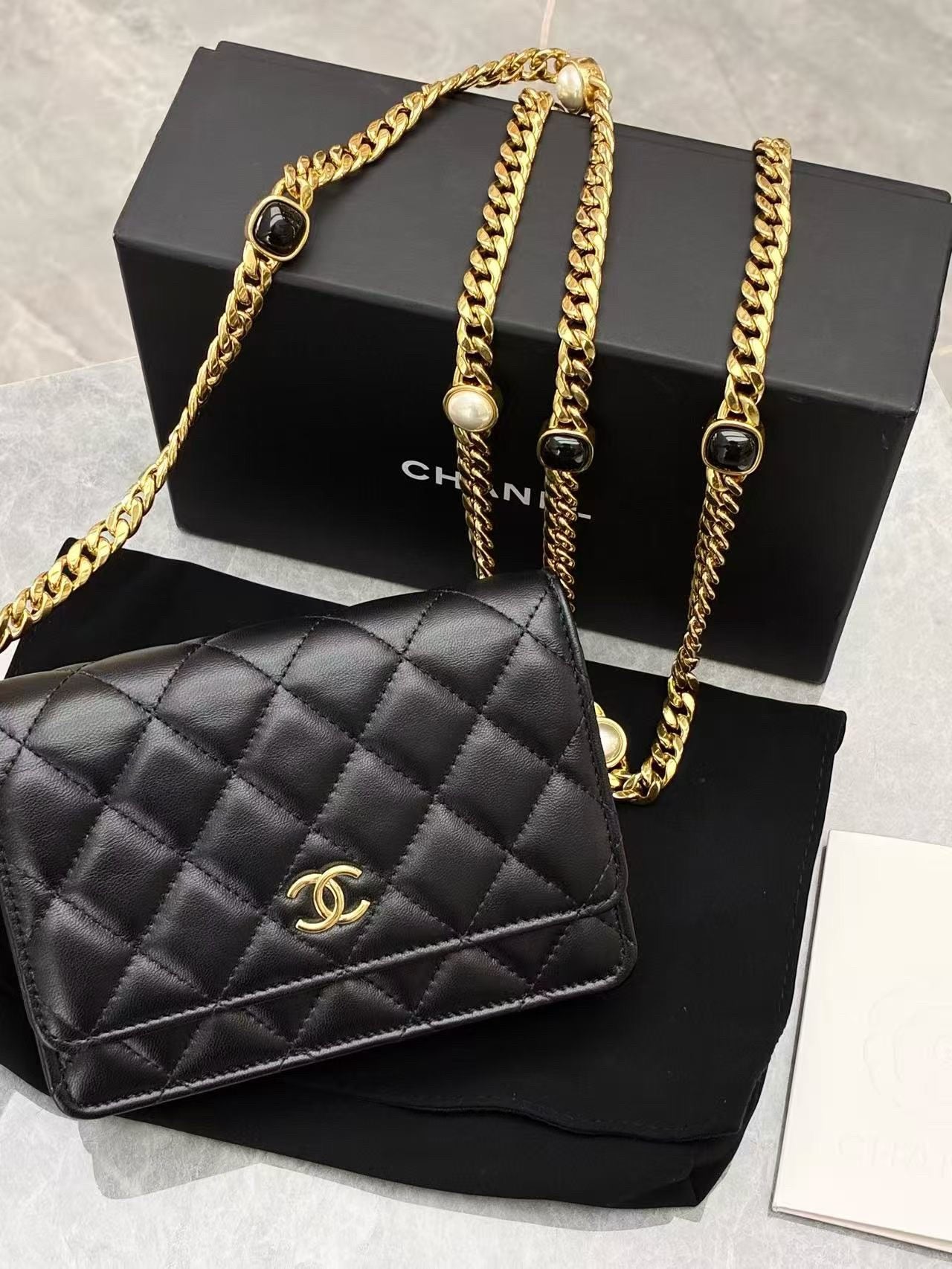 Chanel Pearl Crush Wallet on Chain in black quilted lambskin leather