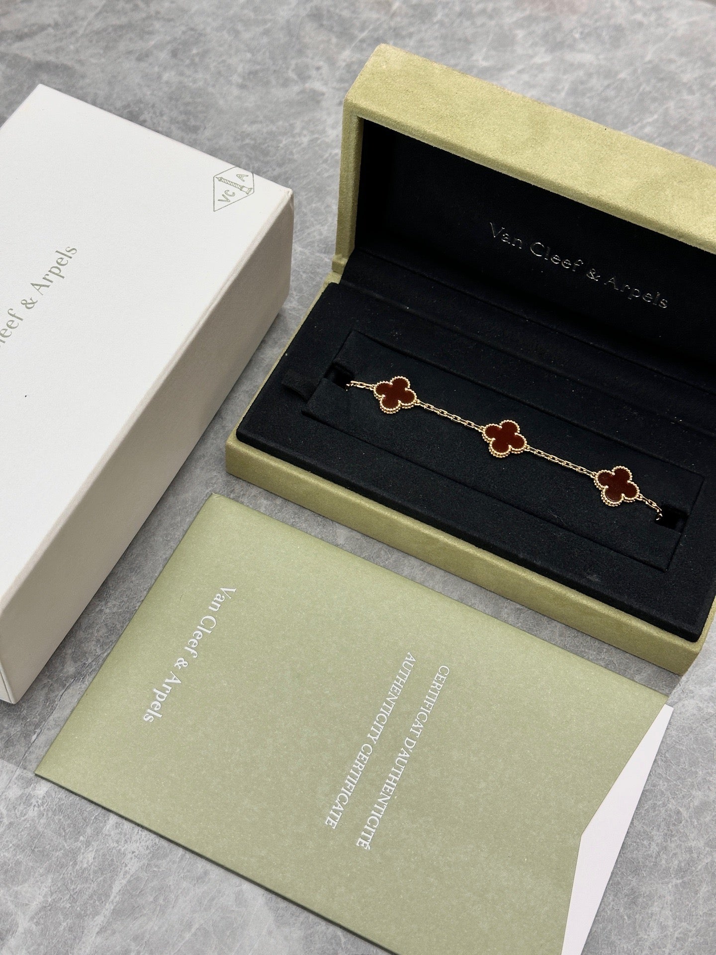 Van Cleef & Arpels Vintage Alhambra bracelet featuring carnelian stone motifs set in 18k yellow gold
