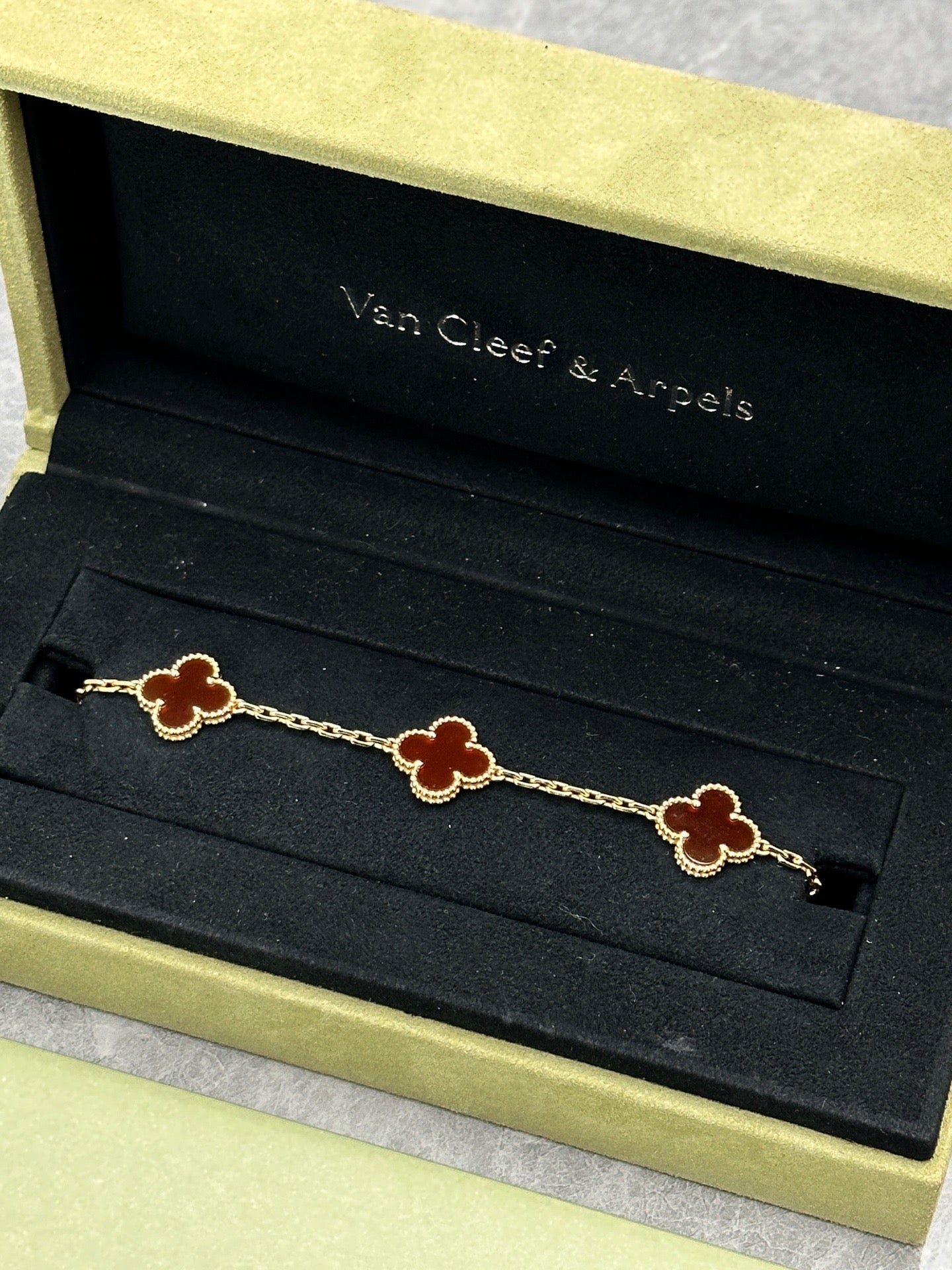 Van Cleef & Arpels Vintage Alhambra bracelet featuring carnelian stone motifs set in 18k yellow gold