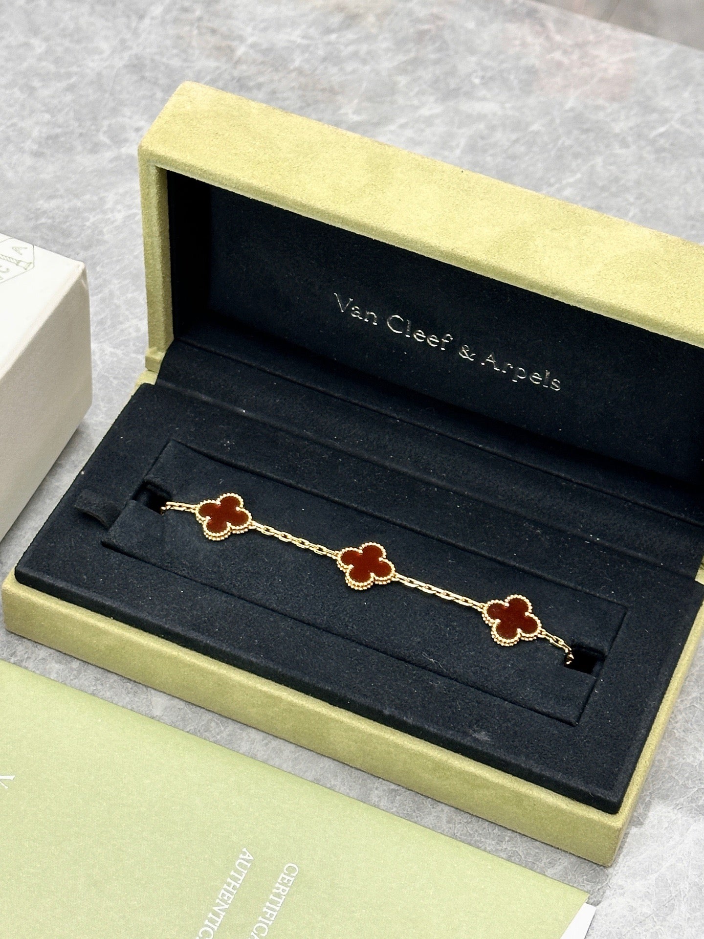 Van Cleef & Arpels Vintage Alhambra bracelet featuring carnelian stone motifs set in 18k yellow gold