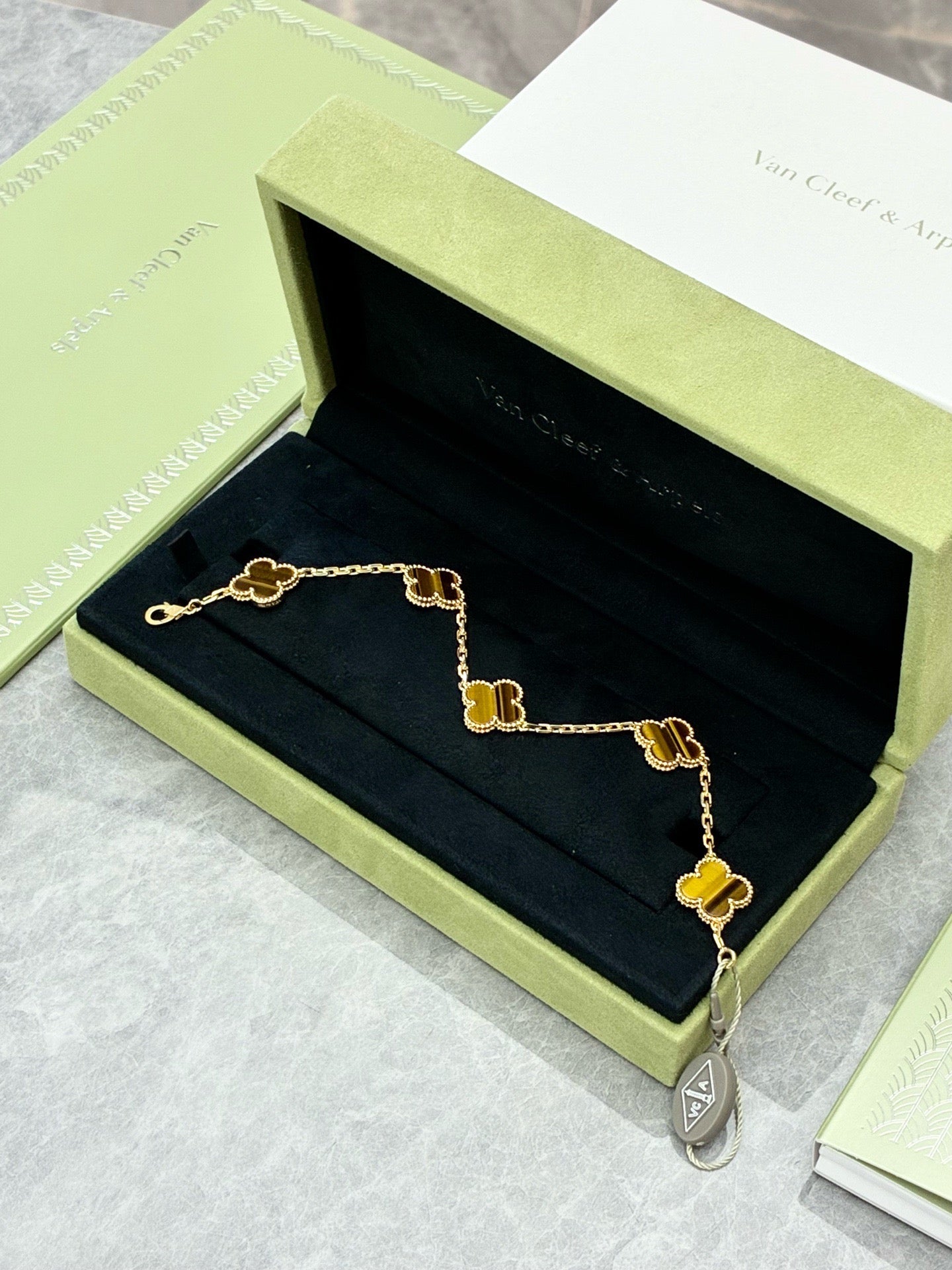 This Van Cleef & Arpels Vintage Alhambra bracelet features five motifs (tiger eye set in 18K yellow gold)