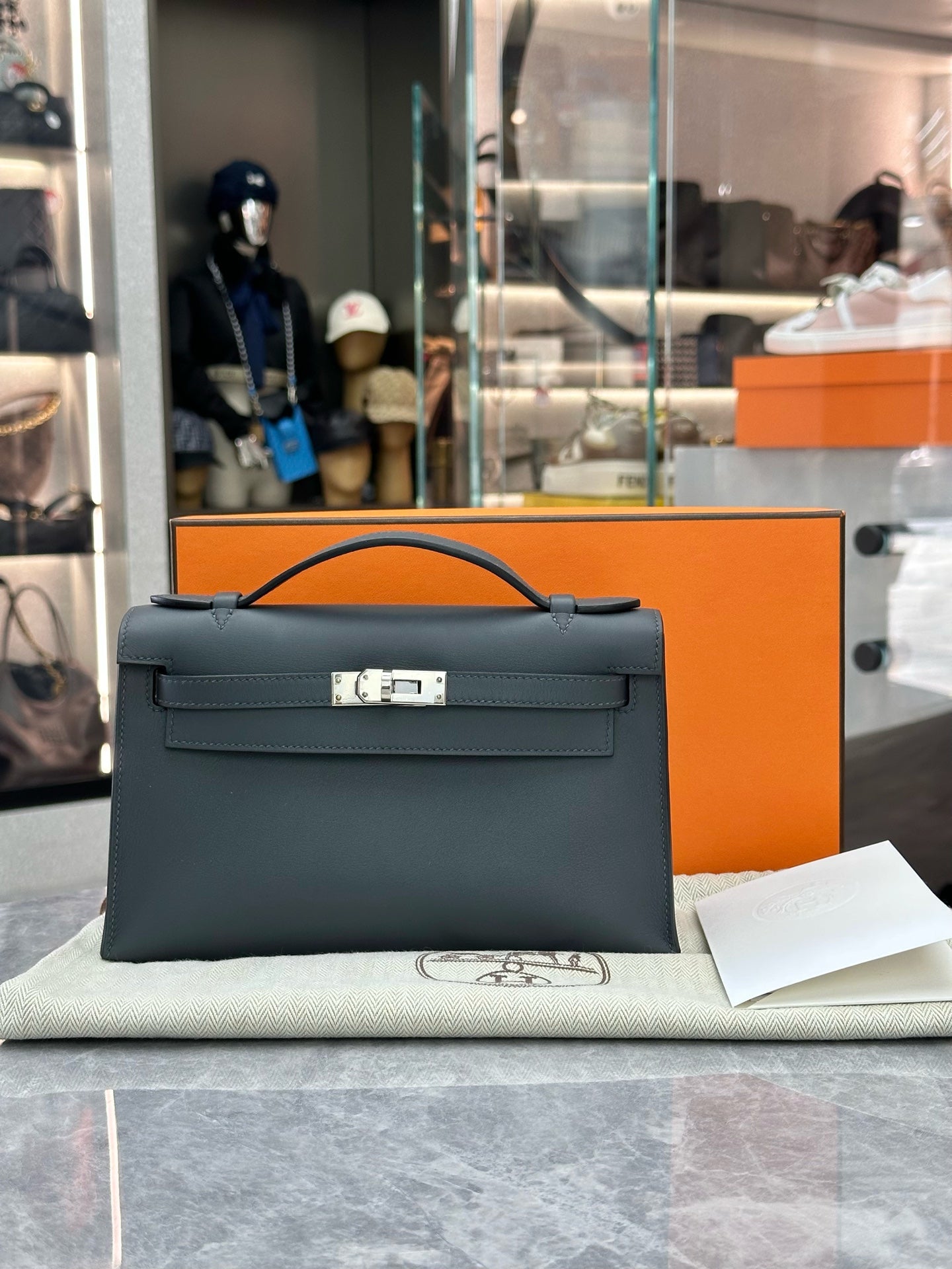 HERMÈS Mini Kelly I – Haze Grey Leather, Palladium Hardware, W Stamp, Excellent Pre-Owned