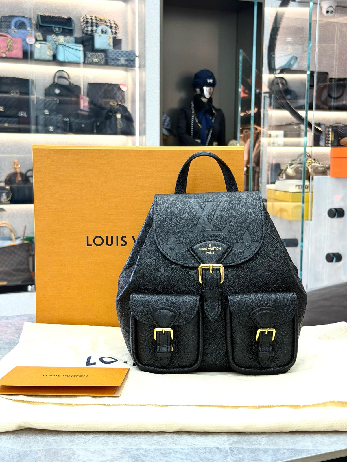 LOUIS VUITTON Monogram Canvas Backpack with Buckle Pockets – Black Grained Leather and Gold-Tone Hardware, 99% New