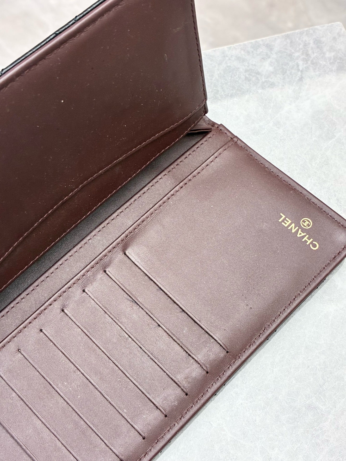 CHANEL Classic Flap Long Wallet – Black Caviar Leather, Gold Hardware, Burgundy Interior