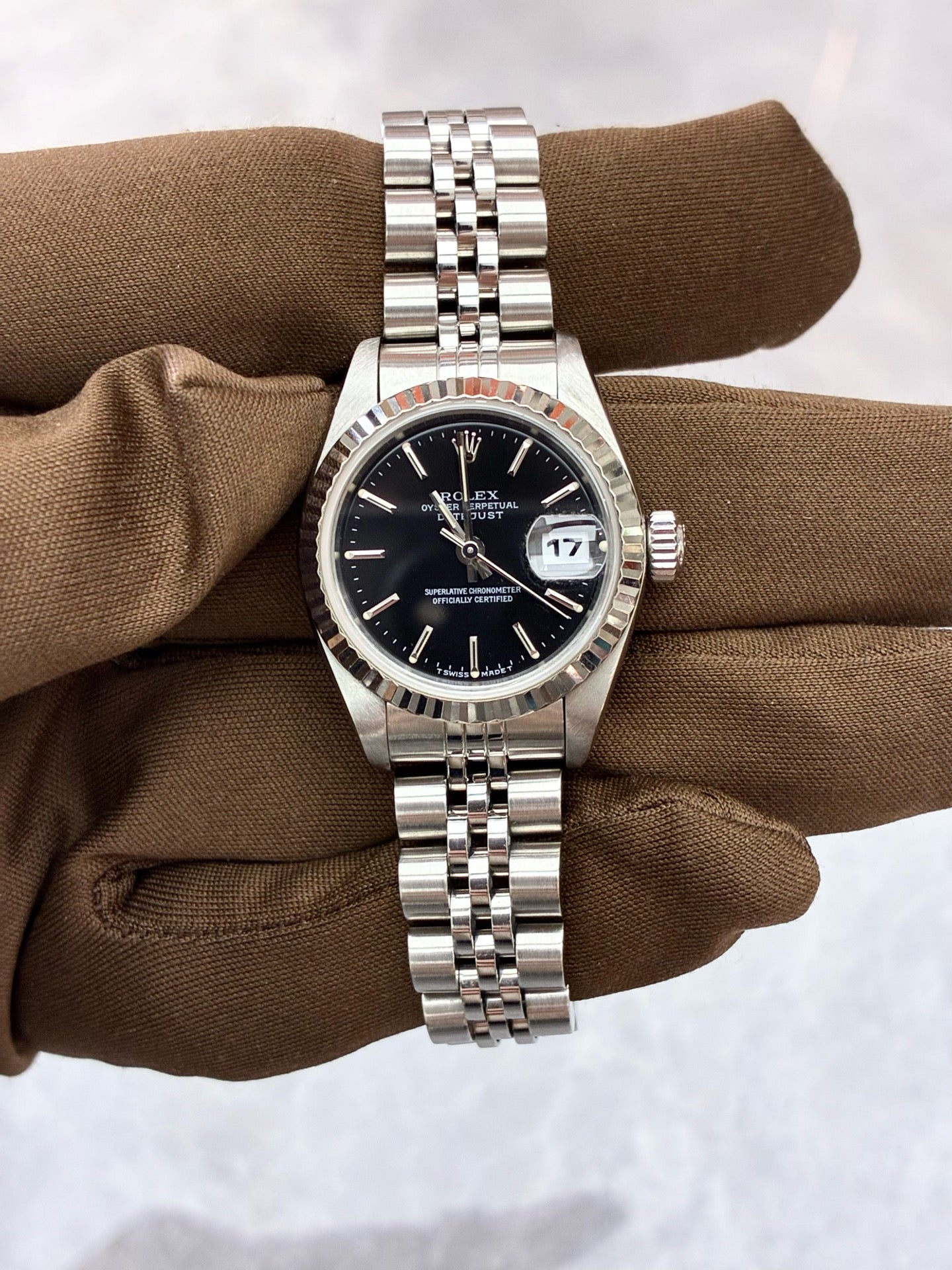 Rolex Datejust 79174 – Stainless Steel, White Gold Fluted Bezel, Black Baton Dial, Pre-Owned