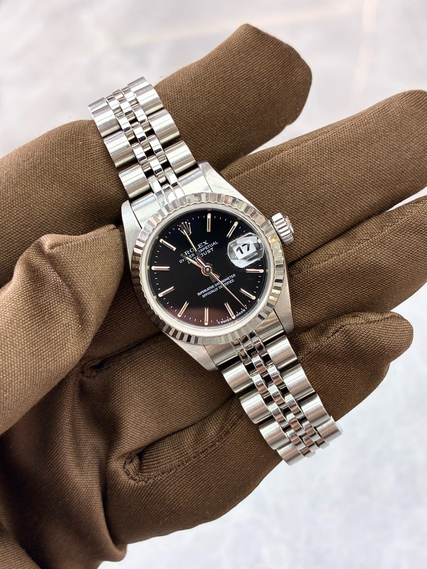 Rolex Datejust 79174 – Stainless Steel, White Gold Fluted Bezel, Black Baton Dial, Pre-Owned