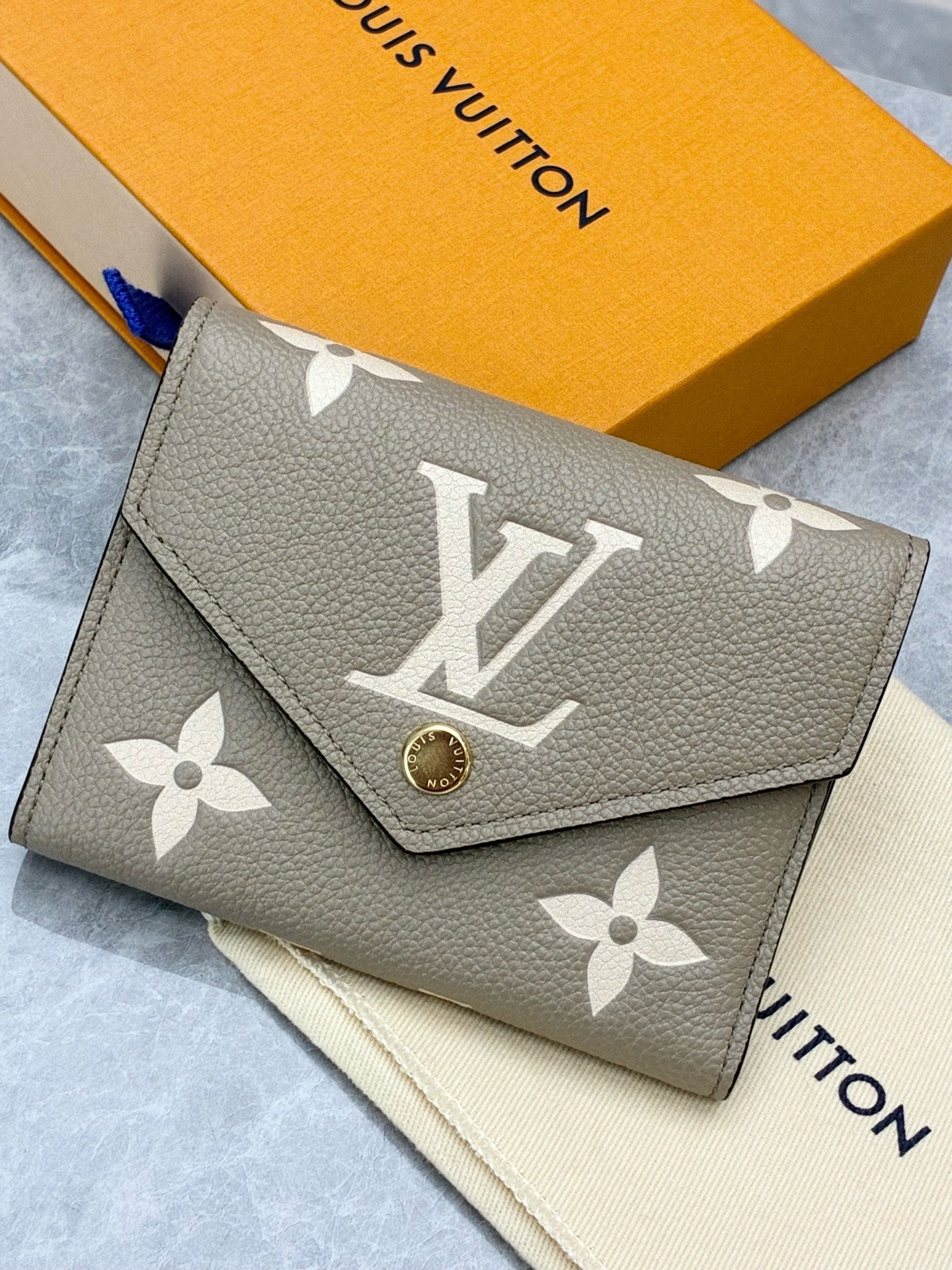LOUIS VUITTON Victorine Wallet – Elephant Grey Monogram Empreinte, Gold Hardware, Brand New