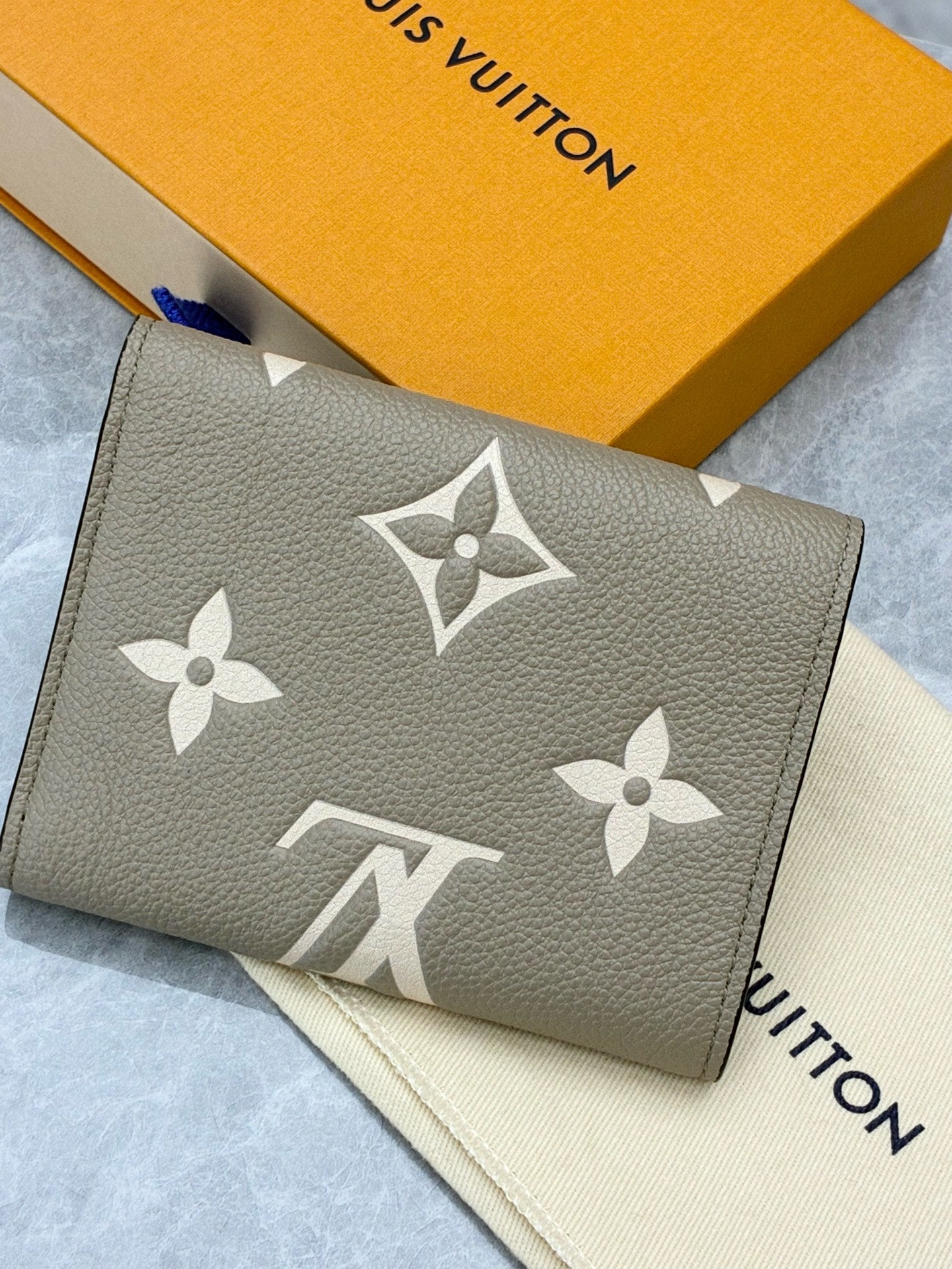 LOUIS VUITTON Victorine Wallet – Elephant Grey Monogram Empreinte, Gold Hardware, Brand New