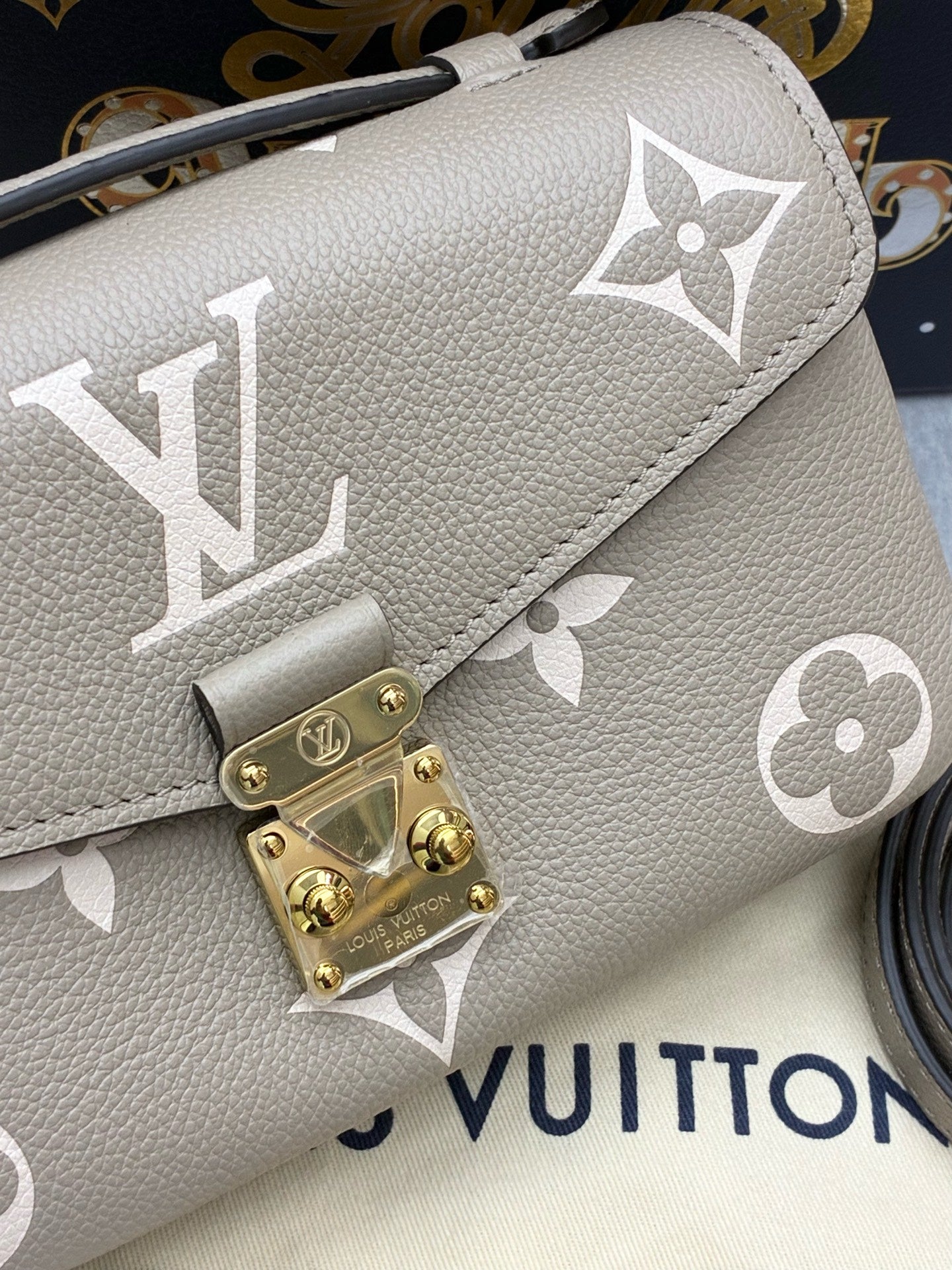 LOUIS VUITTON Pochette Métis East West – Elephant Grey Monogram Empreinte, Gold Hardware, Brand New