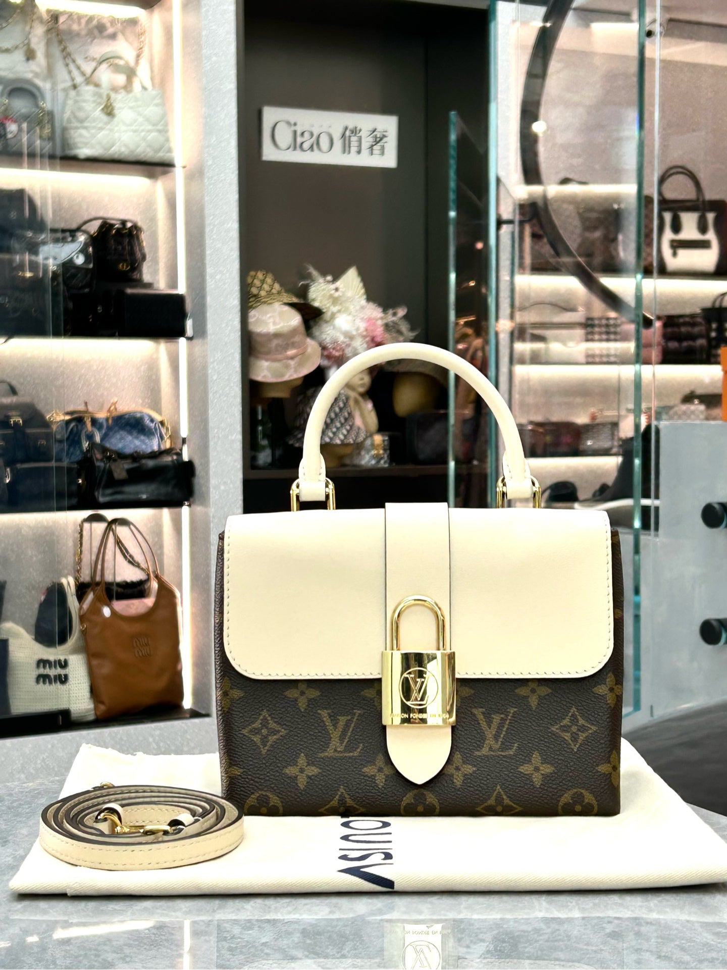 LOUIS VUITTON Locky BB – Monogram Canvas & Cream Leather, Gold Padlock, Very Good Pre-Owned