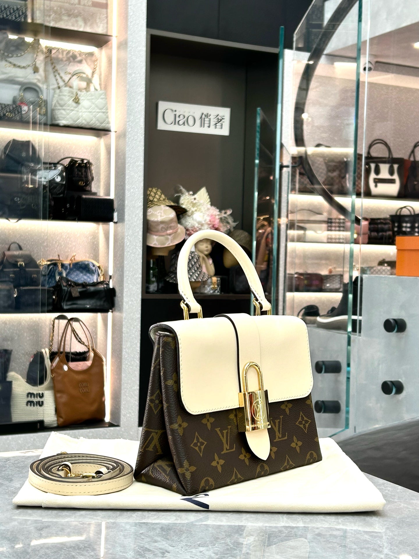 LOUIS VUITTON Locky BB – Monogram Canvas & Cream Leather, Gold Padlock, Very Good Pre-Owned