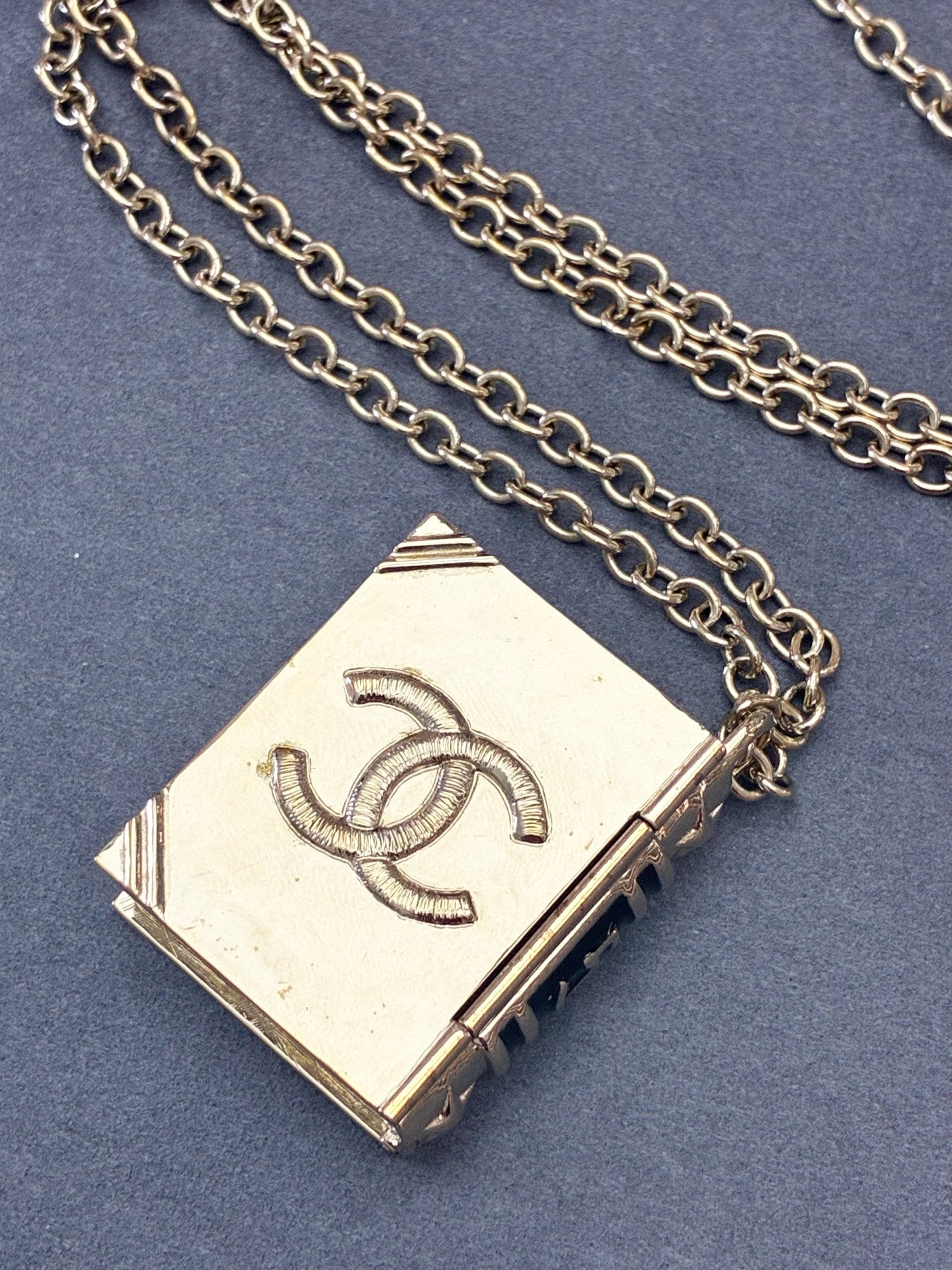 CHANEL Lion Spellbook Necklace – Gold-Tone Metal, Lion & CC Motif, Very Good Pre-Owned