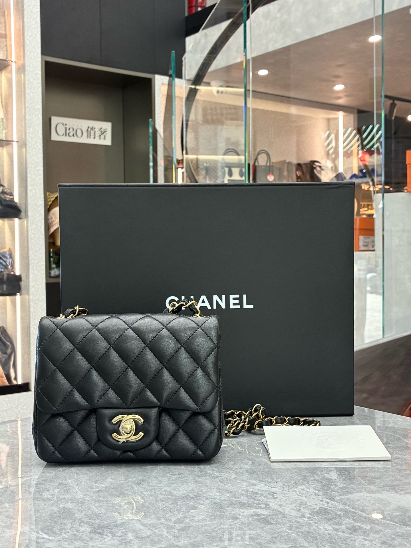 CHANEL Classic Flap Mini Square – Black Lambskin, Champagne Gold Hardware, Reference A69900, Excellent Pre-Owned