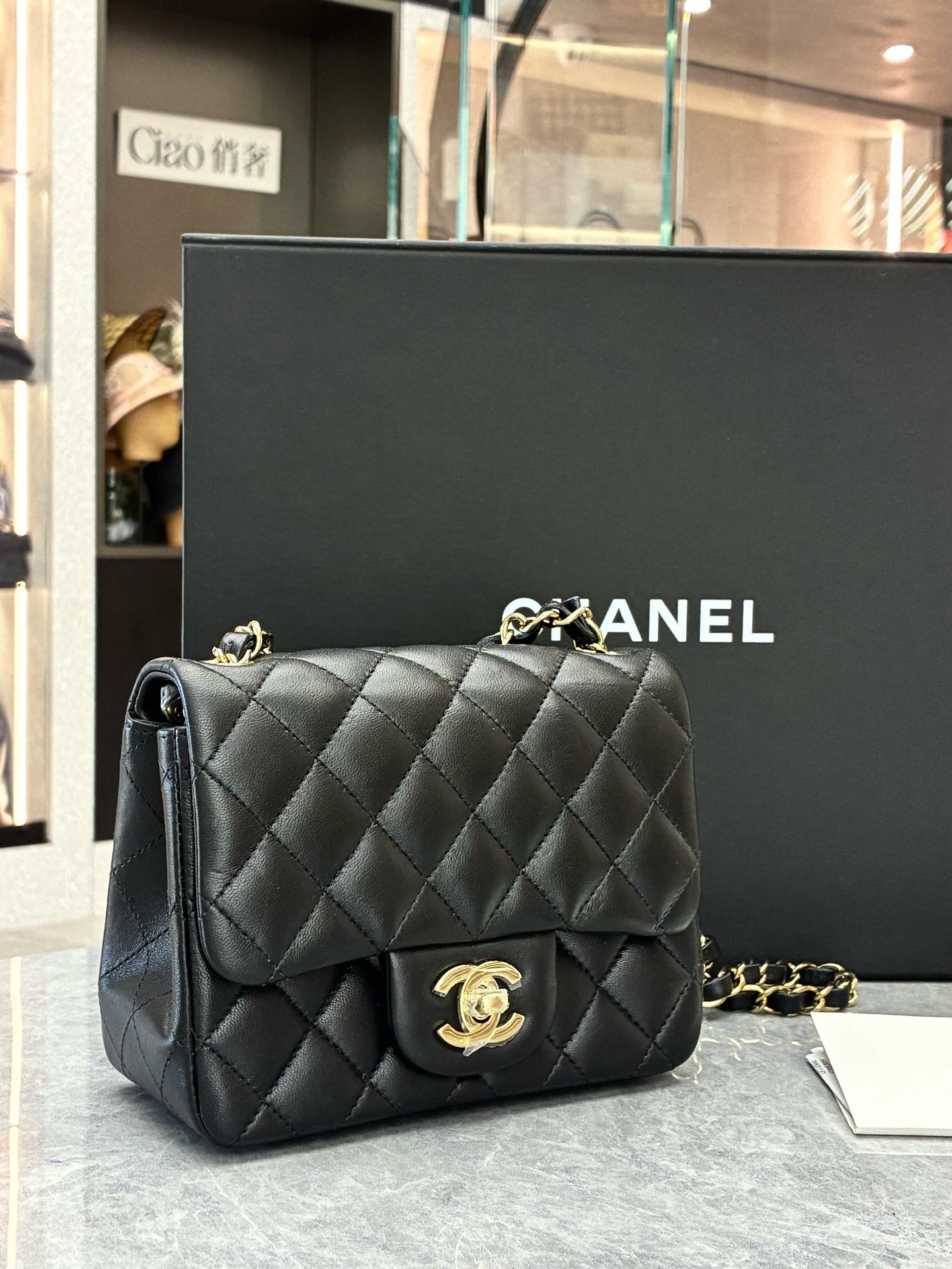 CHANEL Classic Flap Mini Square – Black Lambskin, Champagne Gold Hardware, Reference A69900, Excellent Pre-Owned