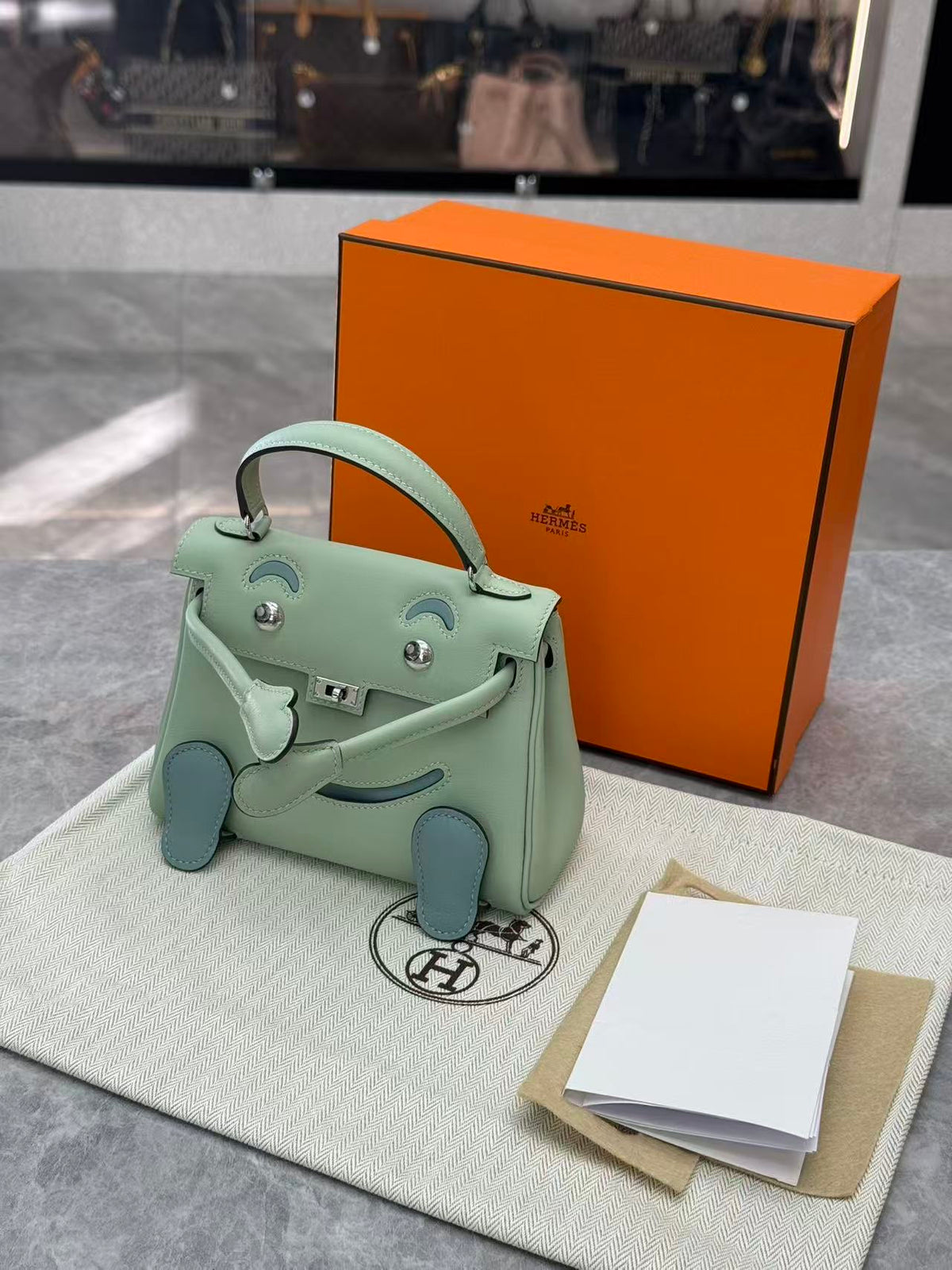HERMÈS Kelly Doll – 6U Mint Swift Leather, Lake Blue Feet, Palladium Hardware, G Stamp, Brand New
