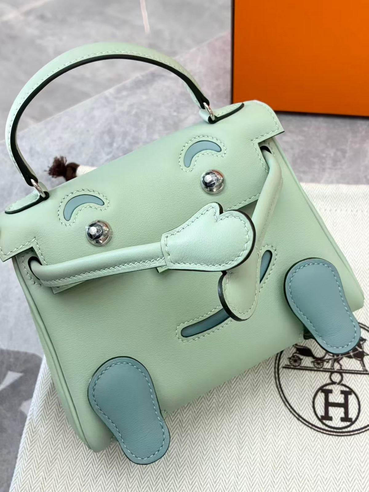 HERMÈS Kelly Doll – 6U Mint Swift Leather, Lake Blue Feet, Palladium Hardware, G Stamp, Brand New