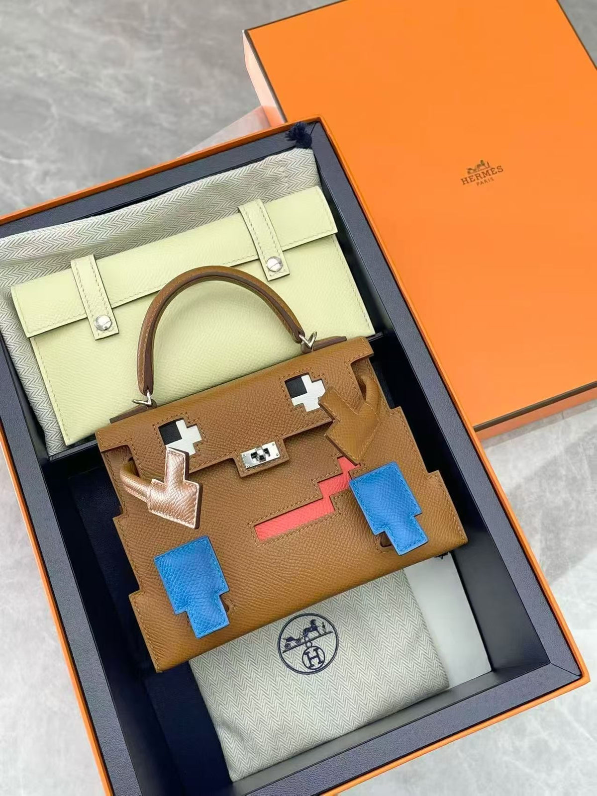 HERMÈS Kelly Doll – Gold Epsom with Bleu France Pixel Mosaic, Palladium Hardware, K Stamp, Brand New