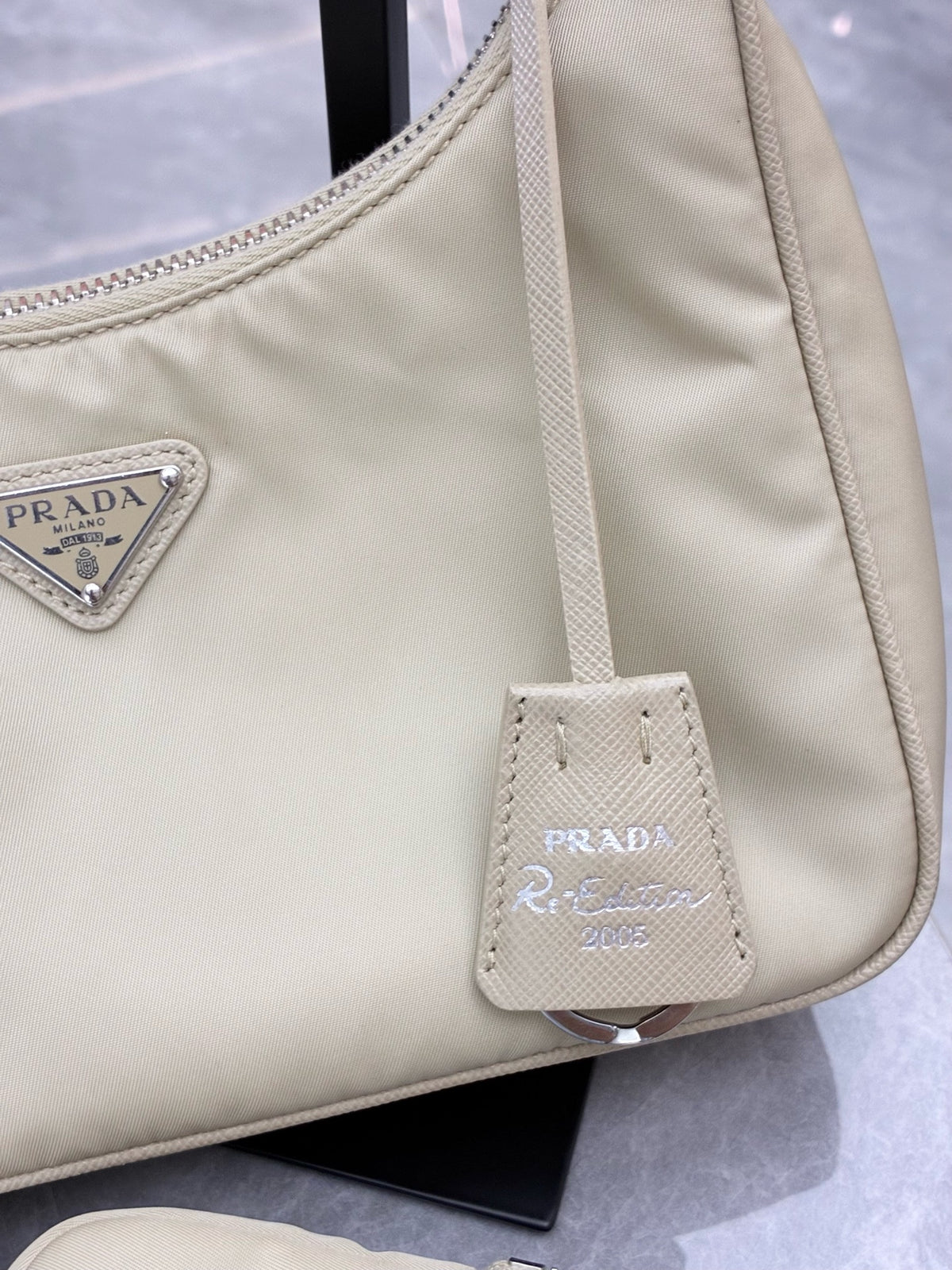 PRADA Re-Nylon Hobo Bag – Milk Tea Nylon with Silver Chain and Woven Strap, Convertible, Good Pre-Owned