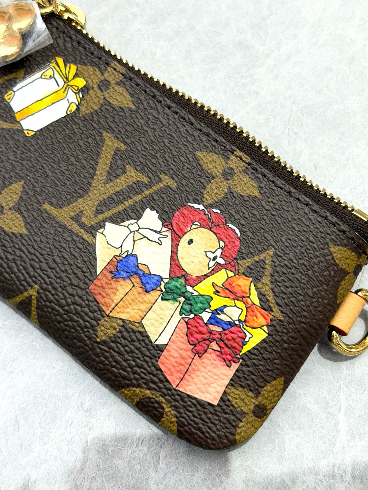 LOUIS VUITTON Vivienne Holiday Clutch – Monogram Coated Canvas with Cartoon Motif and Gold-Tone Hardware, Very Good Pre-Owned