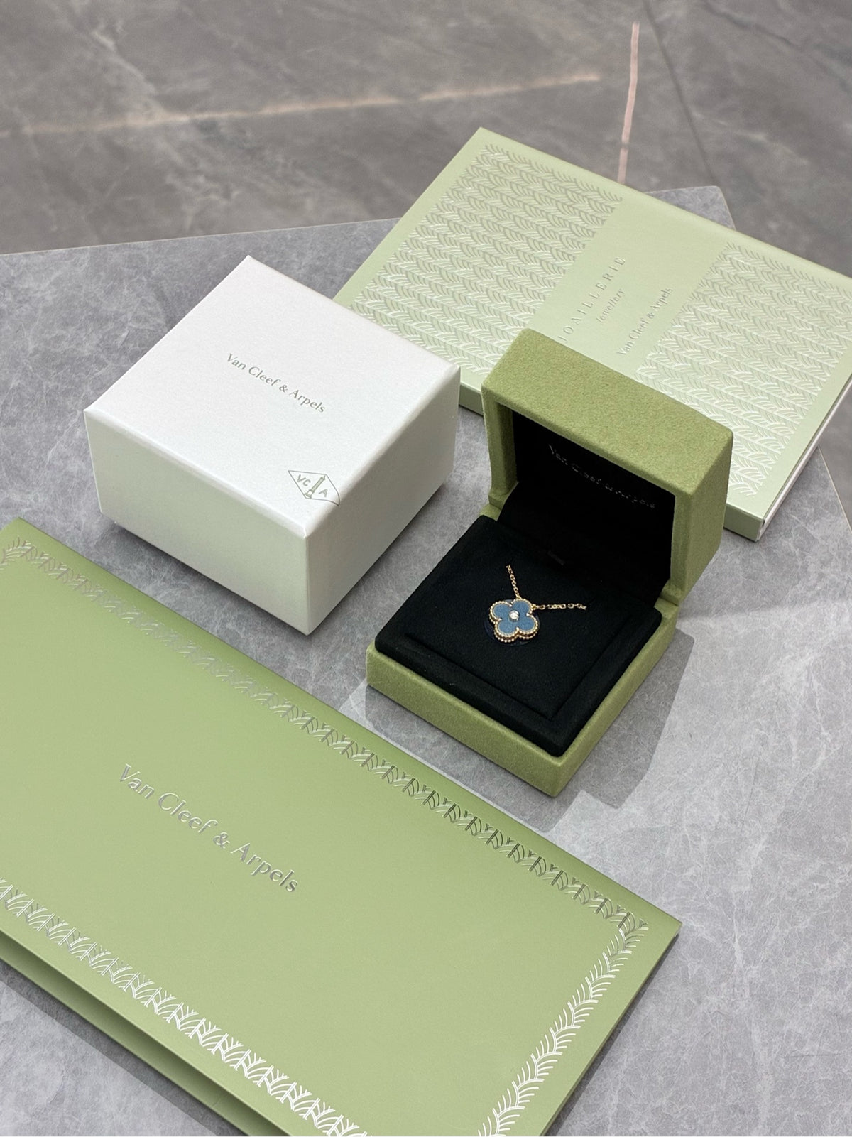 VAN CLEEF & ARPELS Holiday Limited Edition 2026 Alhambra Pendant – Blue-Grey Ceramic with Gold and Diamond Rim, Brand New