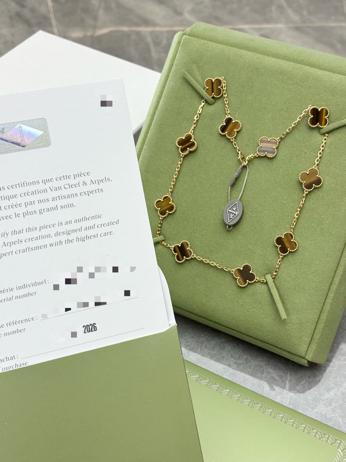 VAN CLEEF & ARPELS Vintage Alhambra Necklace – Ten Motifs in Tiger's Eye with Beaded Gold Rims, Brand New
