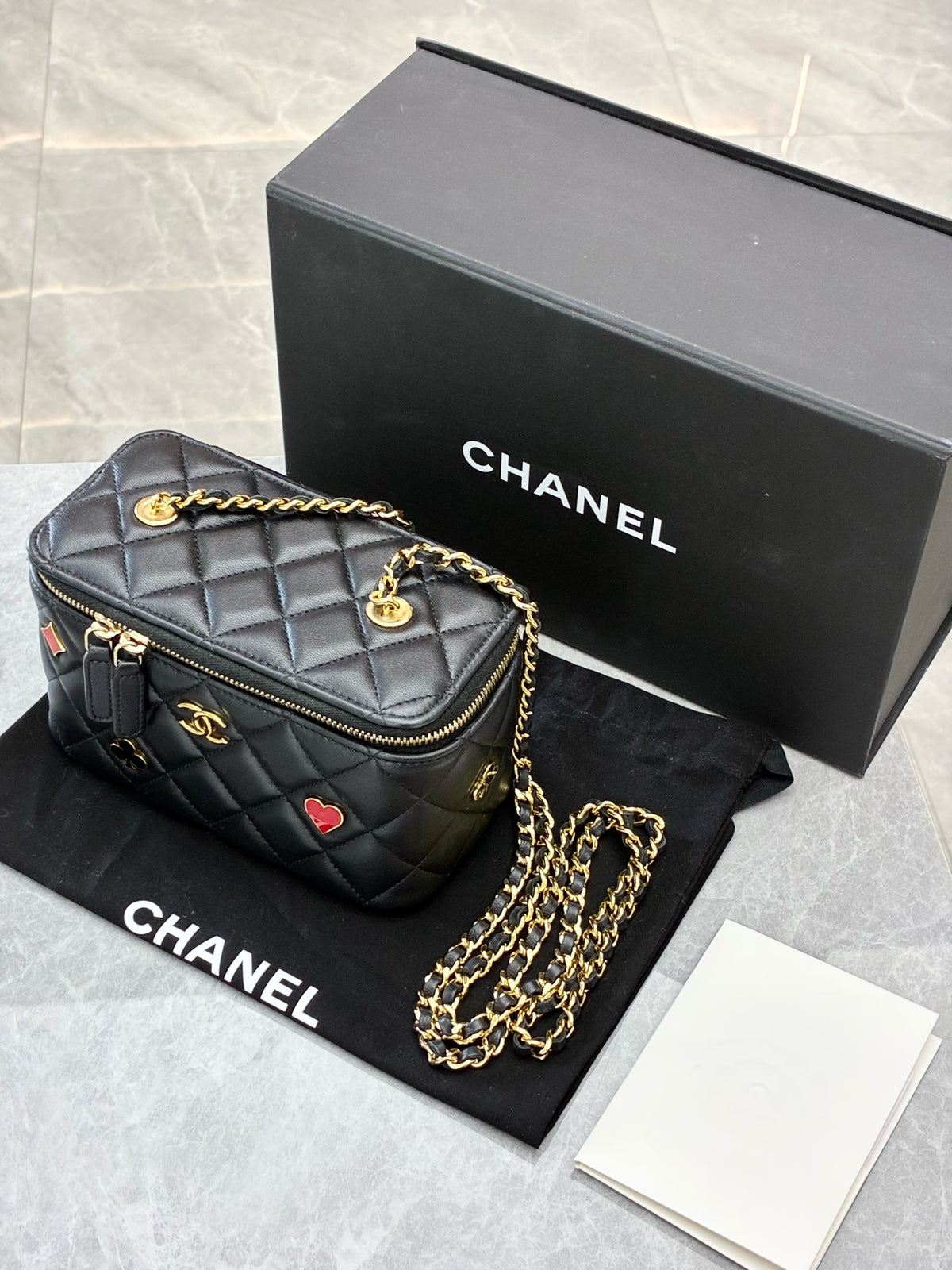 CHANEL 22K Vanity Case – Black Quilted Lambskin with Gold-Tone Chain and Poker-Suit Appliqués, Microchip Era, Good Pre-Owned