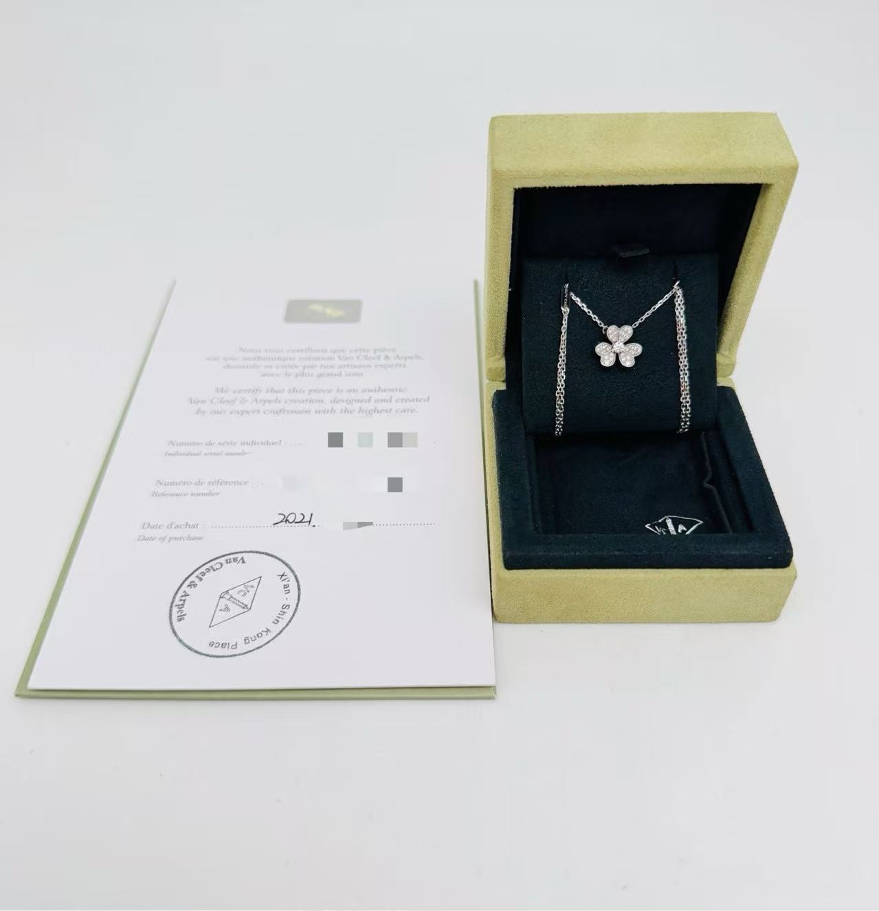 Van Cleef & Arpels Frivole pendant, in 18K white gold and set with diamonds