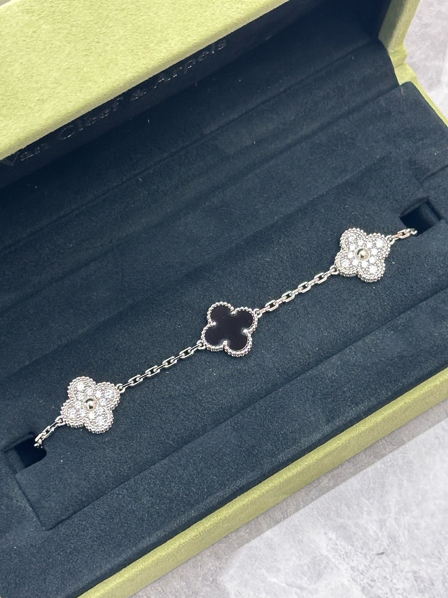 Van Cleef & Arpels Vintage Alhambra 5-motif bracelet in 18K white gold, featuring alternating diamond and onyx motifs