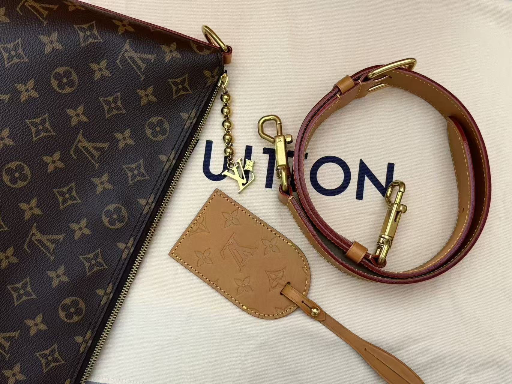 Louis Vuitton Vagabond Hobo bag in monogram coated canvas with vachetta leather trim and gold-toned hardware